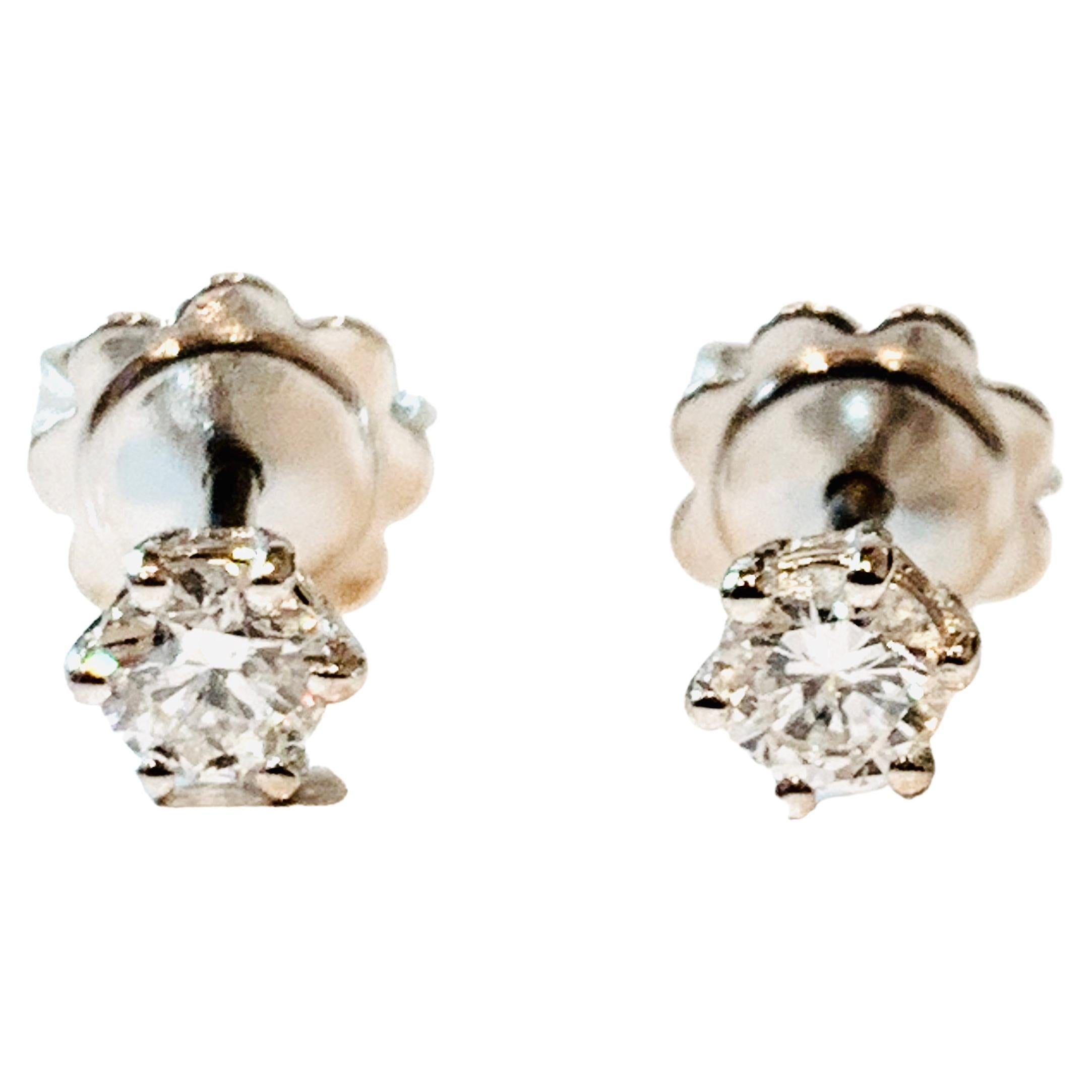 These certified 0.27 carat Diamond stud earrings are from the HRD Antwerp Star collection. 

Designed with the Diamond nestled within a 5 pointed 18Kt white Gold star and secured on the ear with butterfly back closures. 

High quality natural