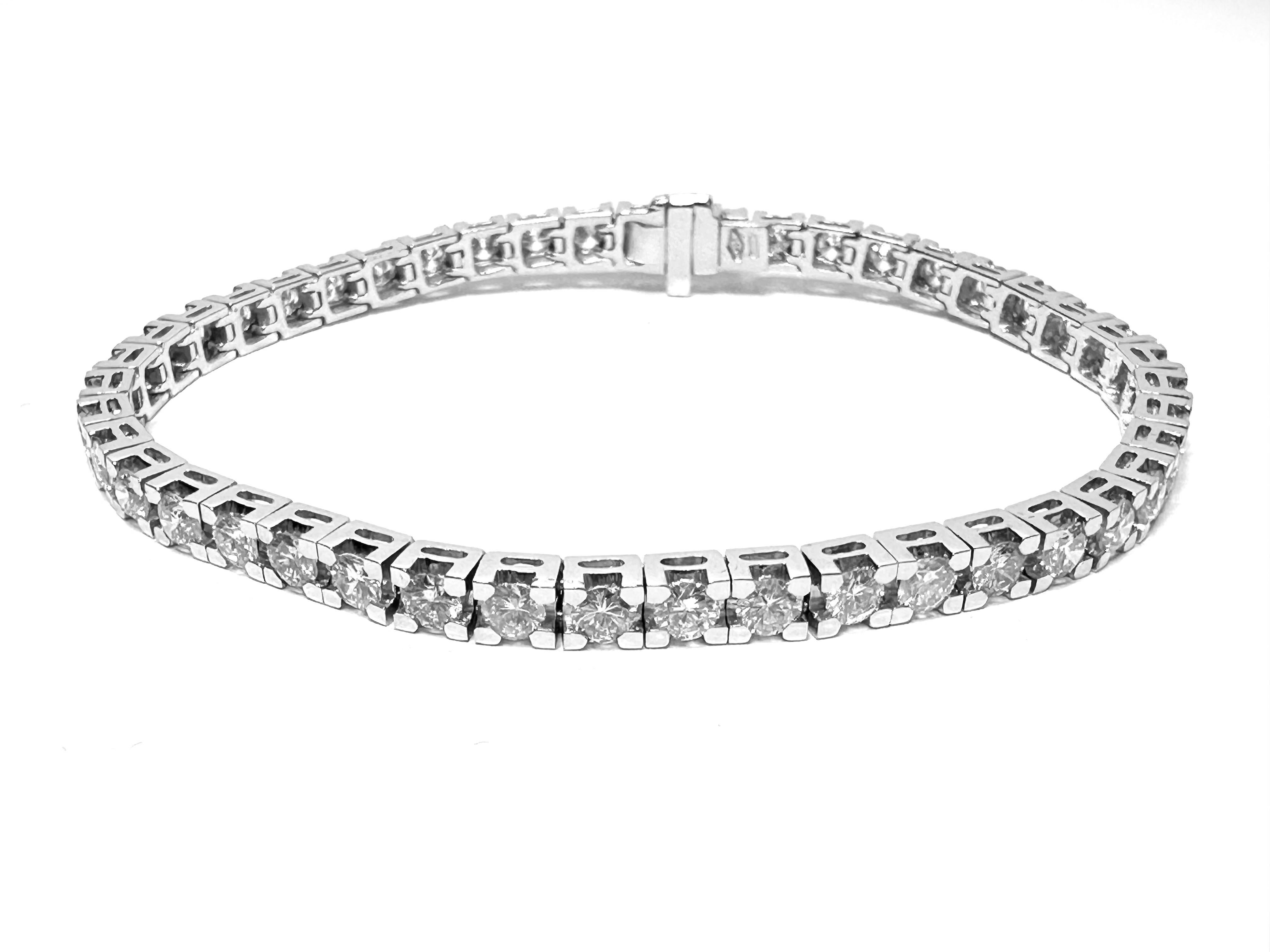 The HRD Certified Tennis Bracelet in White Gold is a stunning piece of jewelry that exudes sophistication and elegance. Crafted from 18kt white gold, this bracelet features a mesmerizing array of diamonds totaling 5.60 carats in weight.

Each