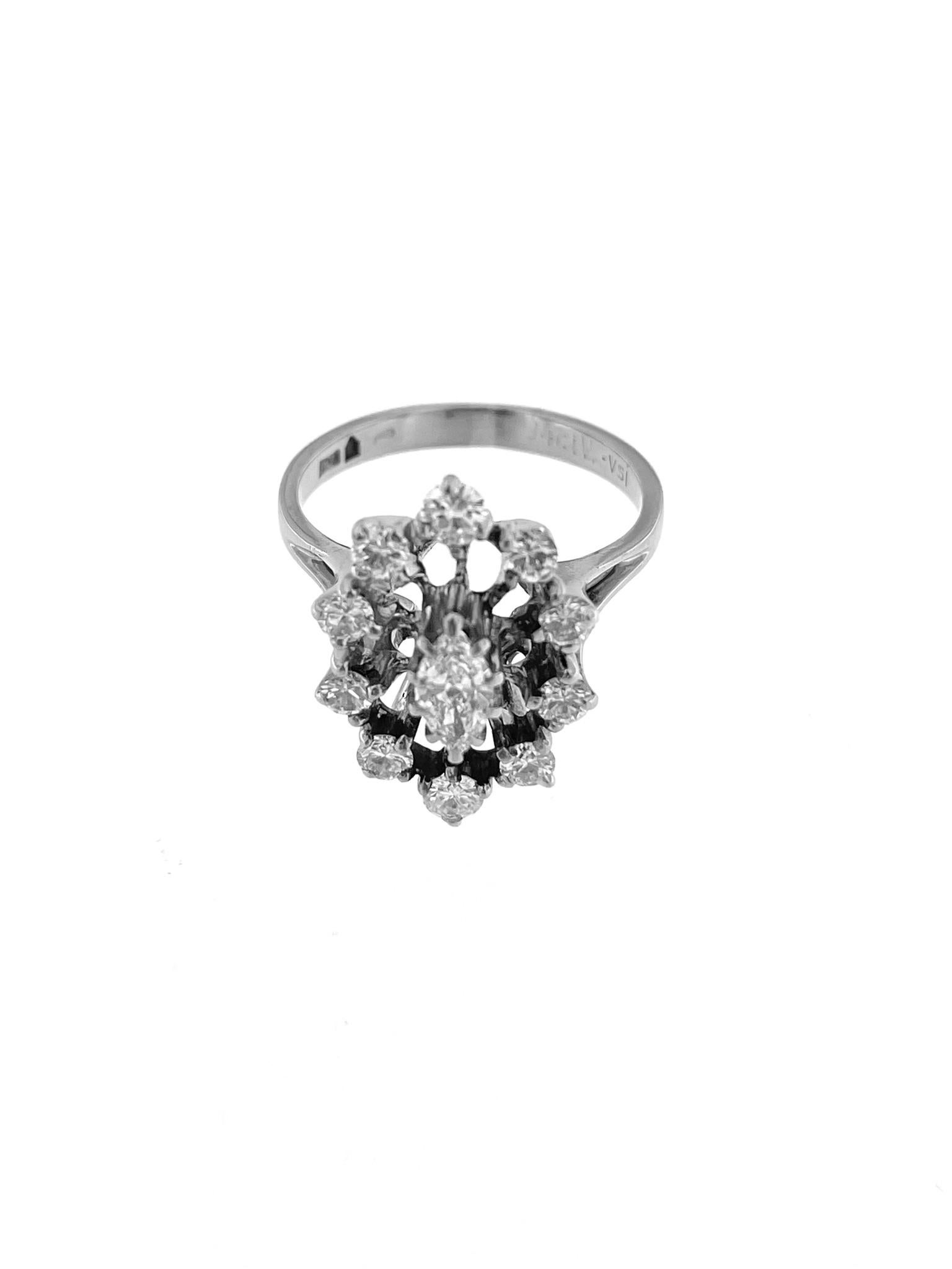 The HRD Certified White Gold Art Deco Cocktail Ring is an exquisite piece of jewelry crafted with precision and sophistication. Made from high-quality 18kt white gold, this ring showcases a stunning marquise cut central stone weighing 0.40 carats.