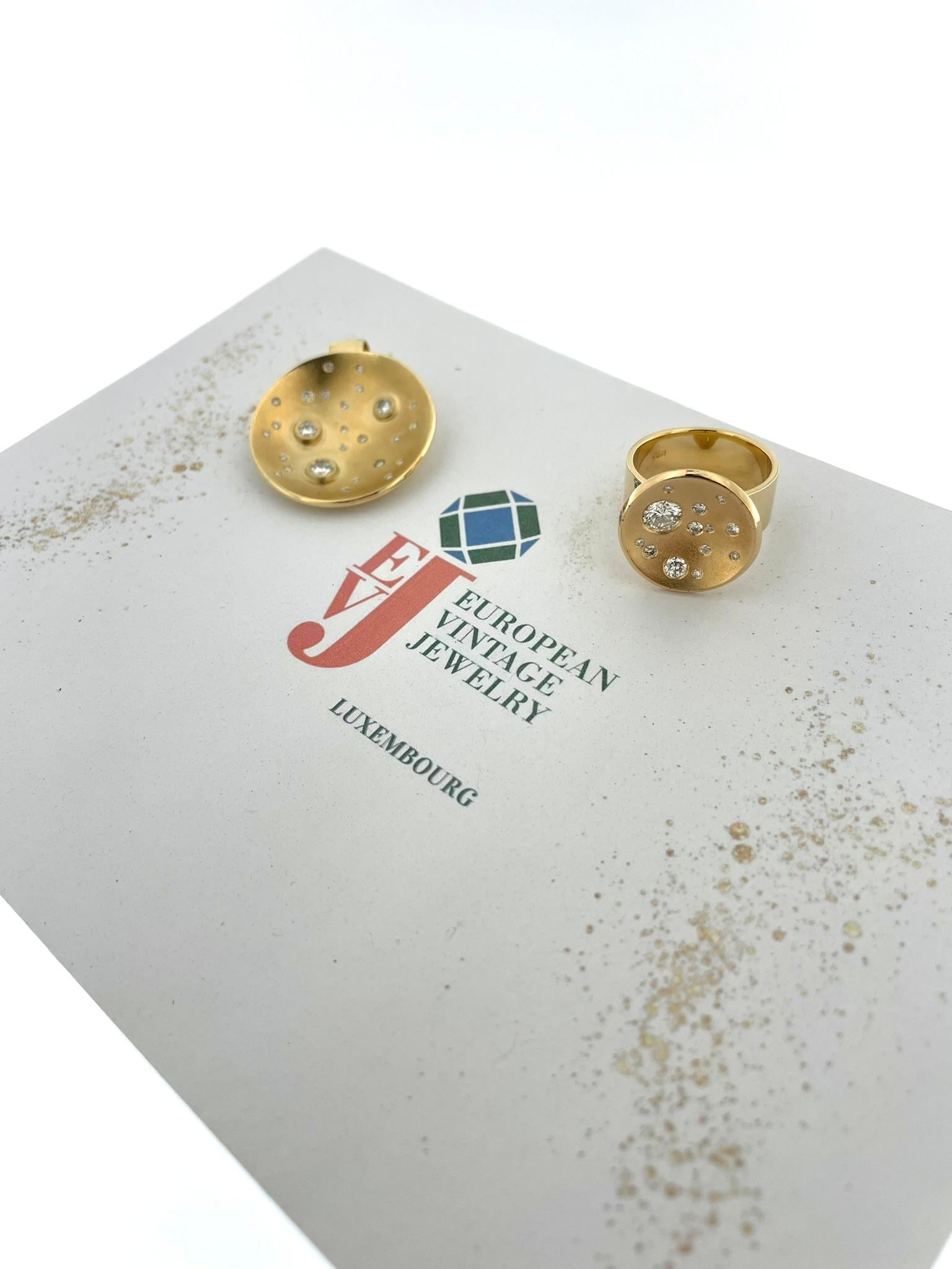 Measurements : 
Pendant : Length : 3.5cm , Width : 2.8cm                    
Ring : Top width : 1.6cm
Band width : 0.8cm , Size : 55.7
Chain not included

The HRD Certified Yellow Gold and Diamonds Set Ring and Pendant beautifully capture the