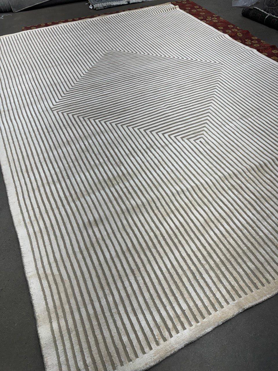 This collection is all about texture. Every design is handwoven in India constructed by a unique plying of wool and viscose. 

Tailored borderless, geometric looks are created out of nothing but the texture and done in colorations that range from a