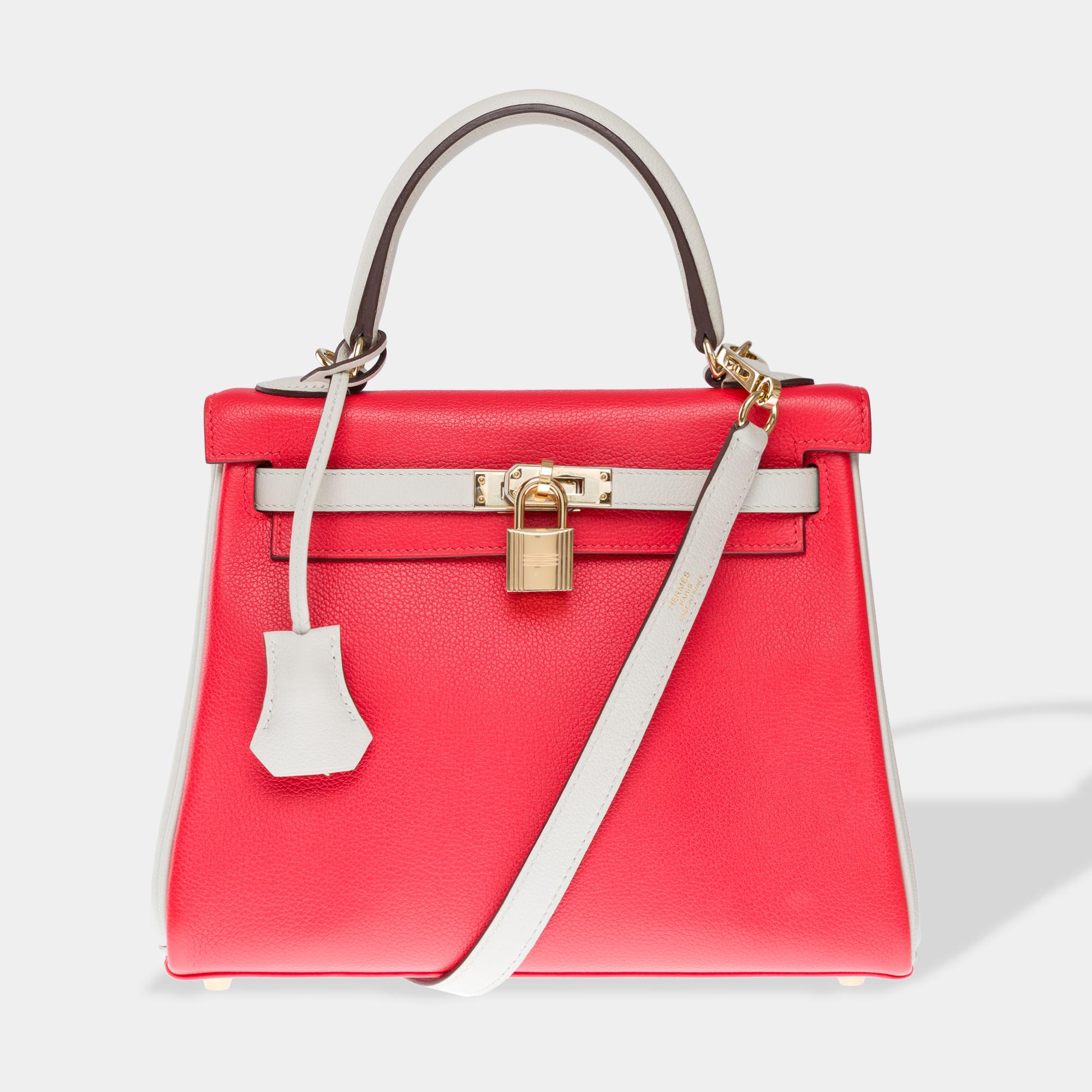Exceptional​ ​&​ ​Rare​ ​Hermes​ ​Kelly​ ​25​ ​handbag​ ​strap​ ​special​ ​order​ ​(HSS)​ ​in​ ​red​ ​casaque​ ​Togo​ ​leather​ ​and​ ​Beton​ ​grey,​ ​champagne​ ​gold​ ​metal​ ​trim,​ ​single​ ​grey​ ​leather​ ​handle,​ ​removable​ ​grey​ ​leather​