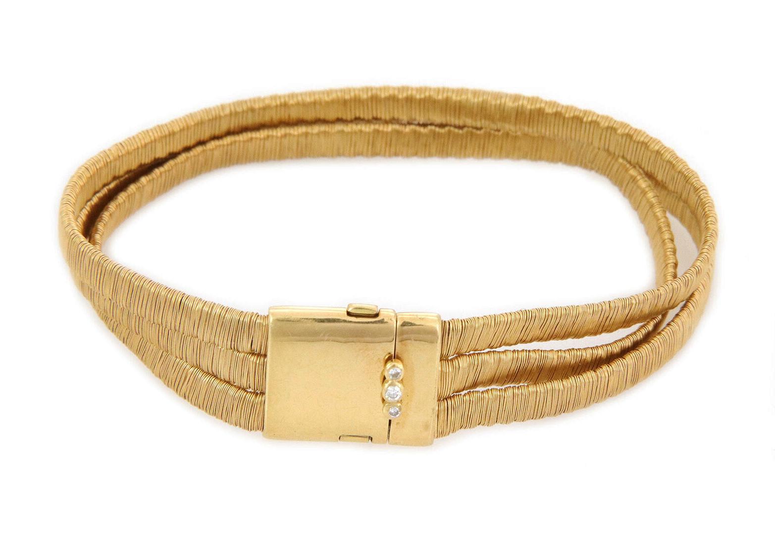 This is an elegant authentic bracelet by H.Stern, crafted from 18k yellow gold featuring silk wrap triple strand flex band attached to the slide bar clasp. Each strand is 4mm wide and the bracelet secure with a slide clasp. It has Stern's star