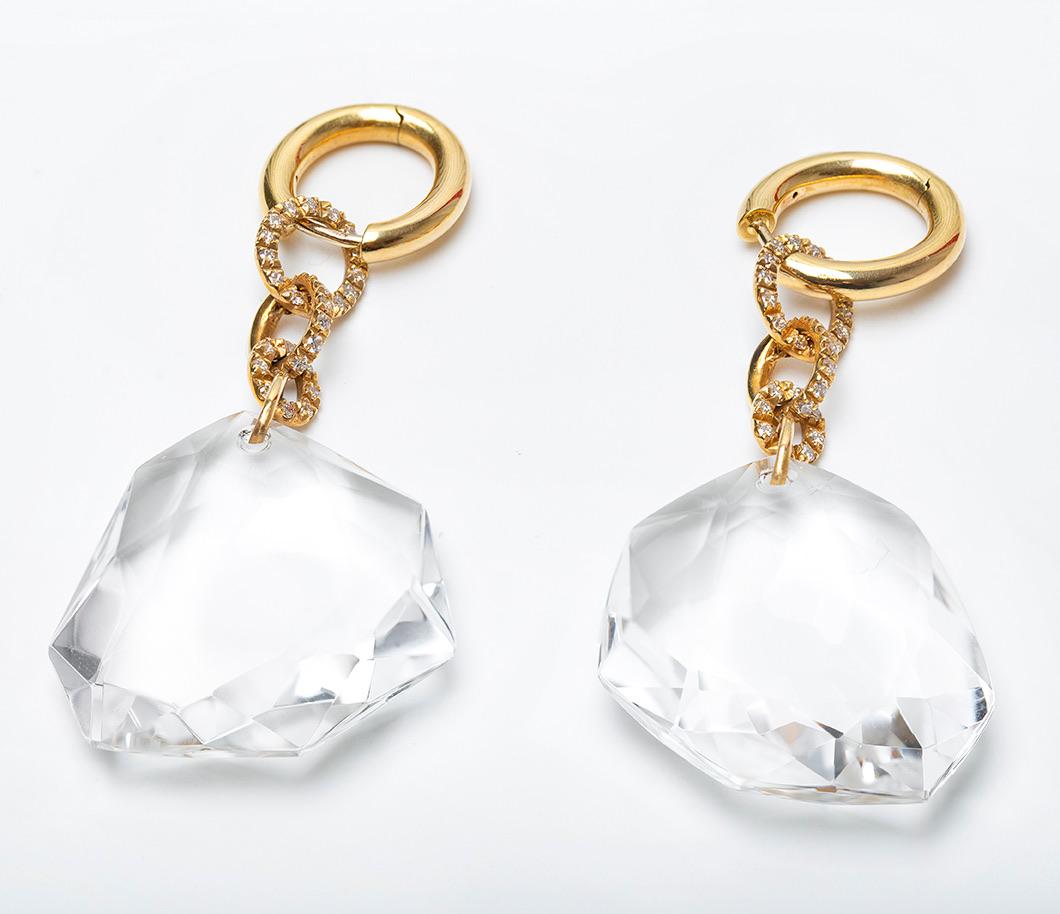 From the limited edition Diane Von Furstenberg for H.Stern this pair of asymetrical faceted rock crystals are suspended beneath pavé-set diamond links. The high polish yellow gold tops can be worn with the dangles or without, and feature post backs.