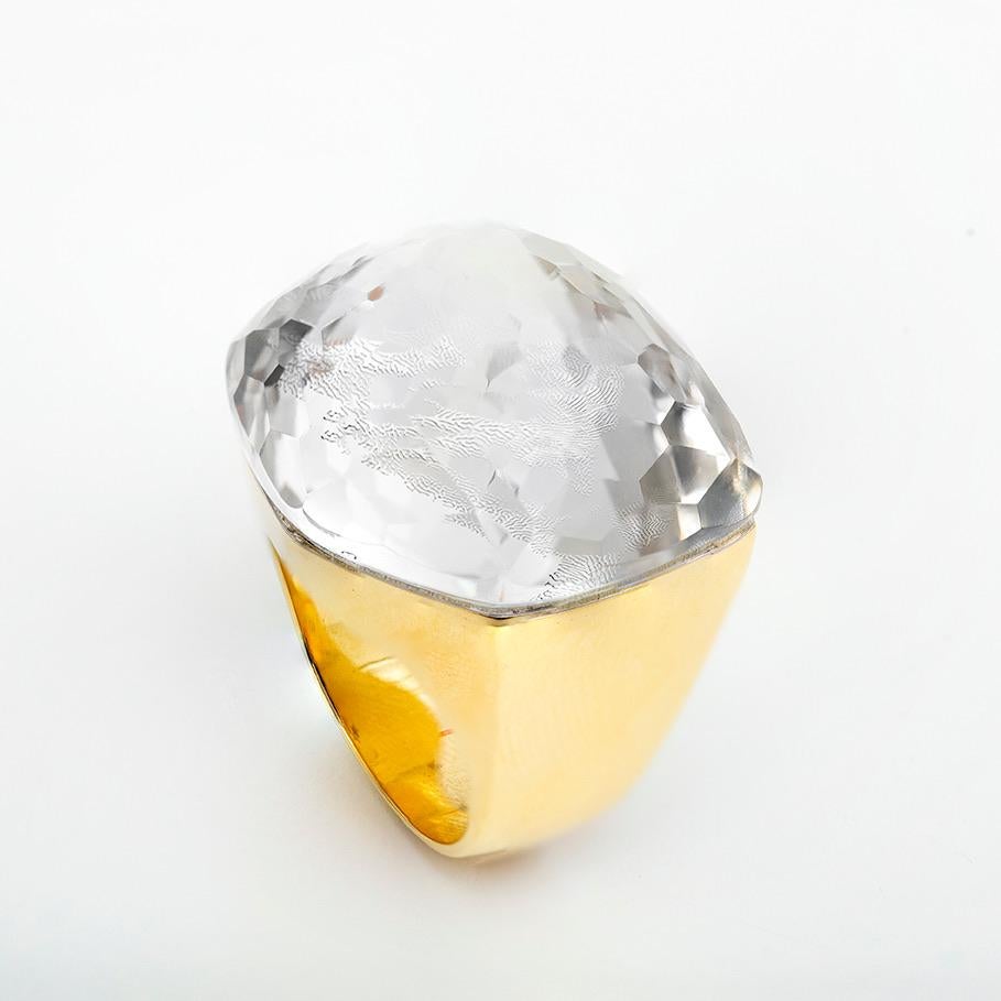 Bold and Contemporary Ring in Polished 18 Karat Yellow Gold featuring a 39 Carat Faceted Rock Crystal. A fabulous statement piece of jewelry which represents perfectly the empowerment of modern woman. The ring size is 54.