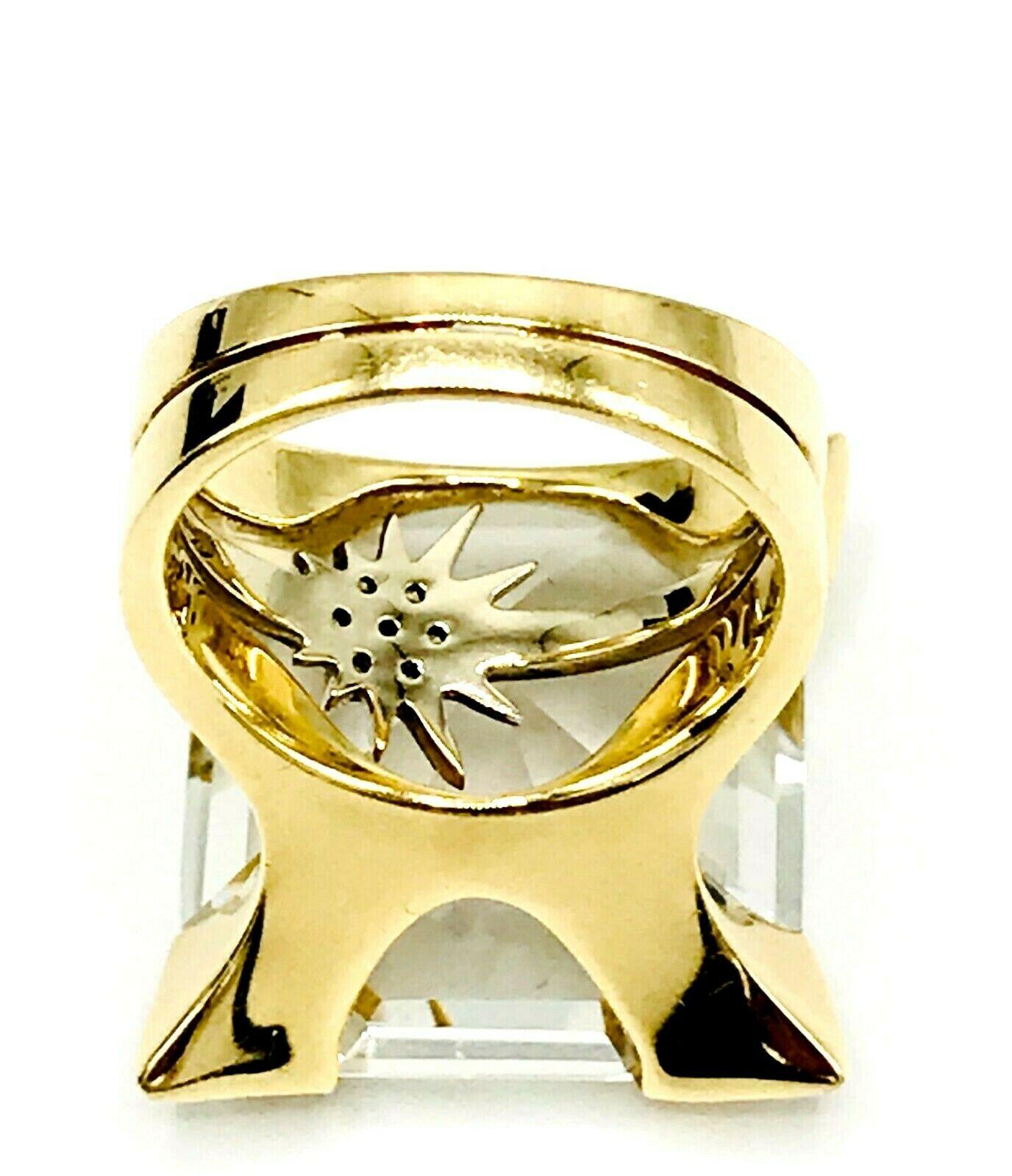 This exquisite cocktail ring by H. Stern is made of 18k yellow and white gold, featuring rock crystal and diamonds. Have a unique setting of the smaller diamond star ring placed behind the main stone. There are four diamonds in the corners, total
