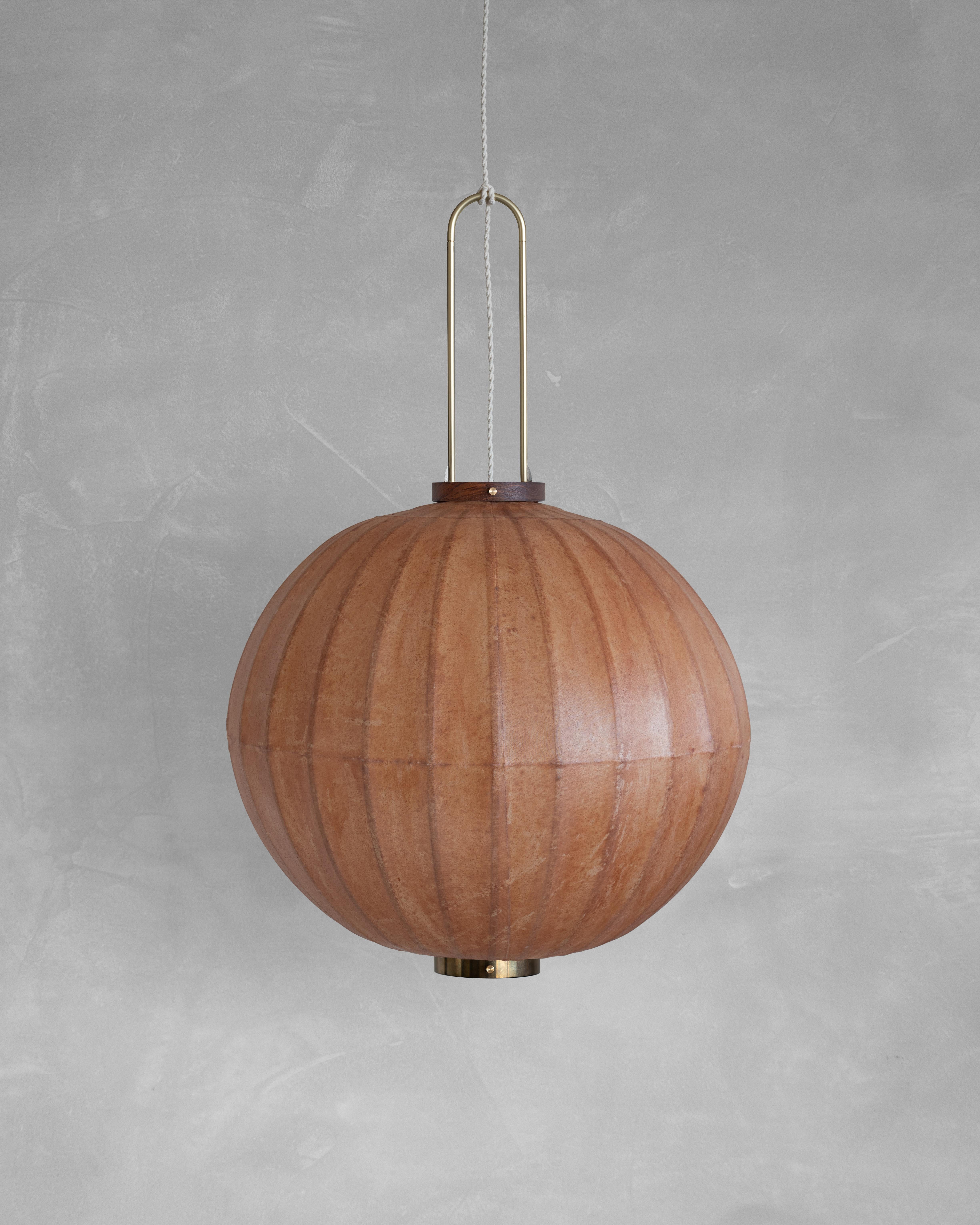 HU01M Pendant Lamp L by Taiwan Lantern
Dimensions: D 57 x W 57 x H 50 cm.
Material: Walnut & bamboo frame, Hand-colored fabrics, Metal pipes, Leather lace, Handmade porcelain ceiling cap.


This brown color is inspired by Wu Xing 五行. Brown presents