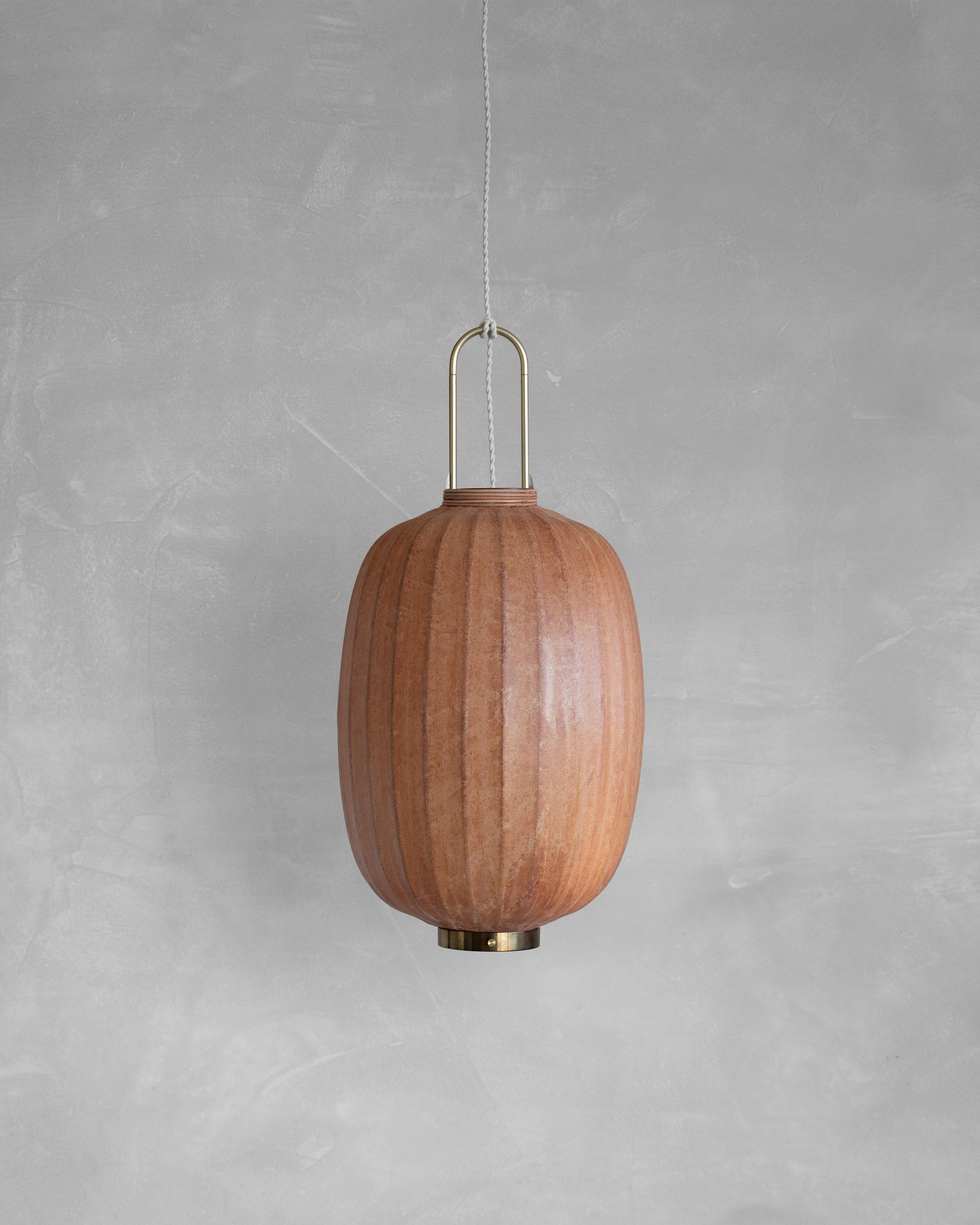 HU01O Pendant Lamp L by Taiwan Lantern
Dimensions: D 49 x W 49 x H 35 cm.
Material: Walnut & bamboo frame, Hand-colored fabrics, Metal pipes, Leather lace, Handmade porcelain ceiling cap.


This brown color is inspired by Wu Xing 五行. Brown presents