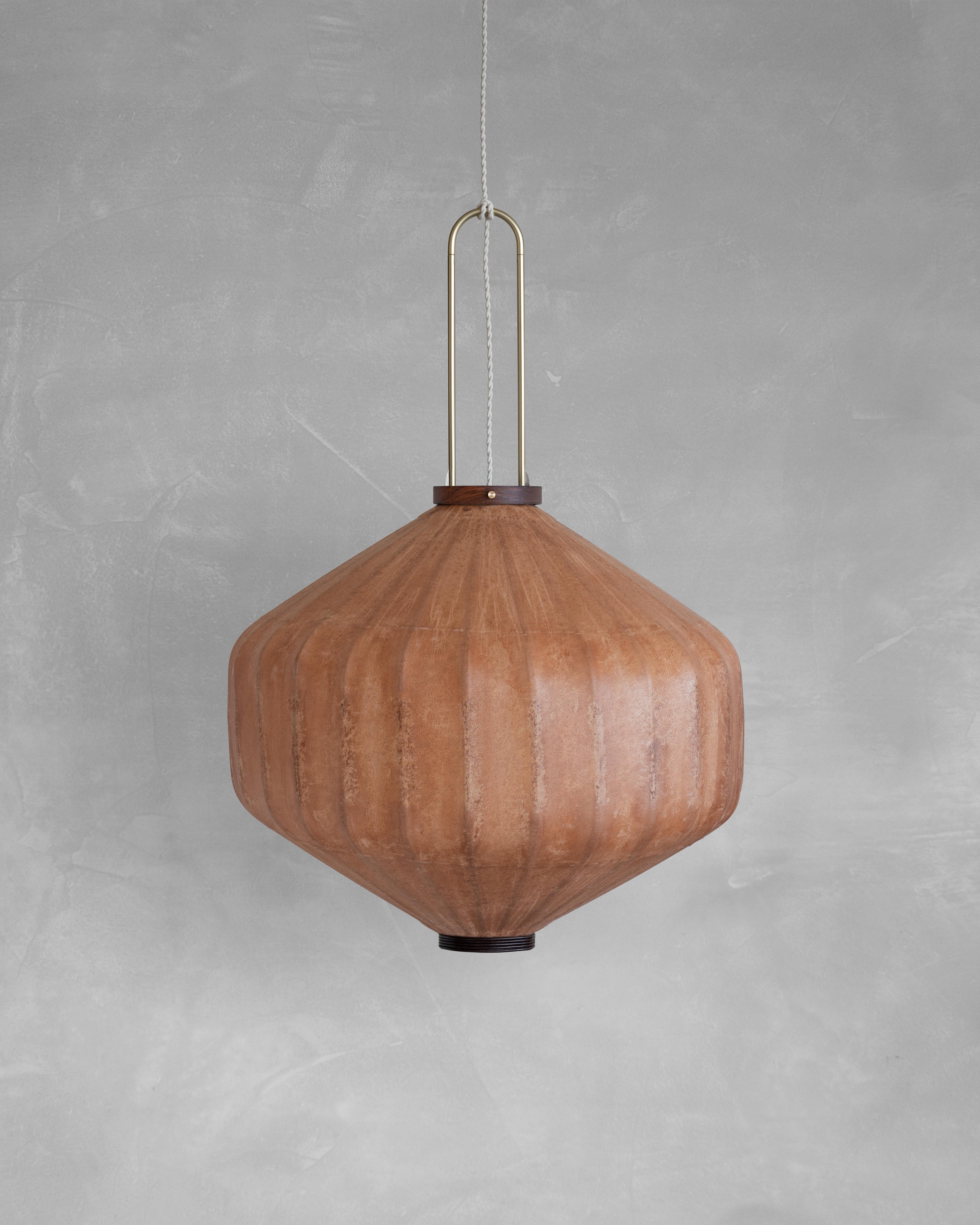 HU01T Pendant Lamp L by Taiwan Lantern
Dimensions: D 57 x W 57 x H 50 cm.
Material: Walnut & bamboo frame, Hand-colored fabrics, Metal pipes, Leather lace, Handmade porcelain ceiling cap.


This brown color is inspired by Wu Xing 五行. Brown presents
