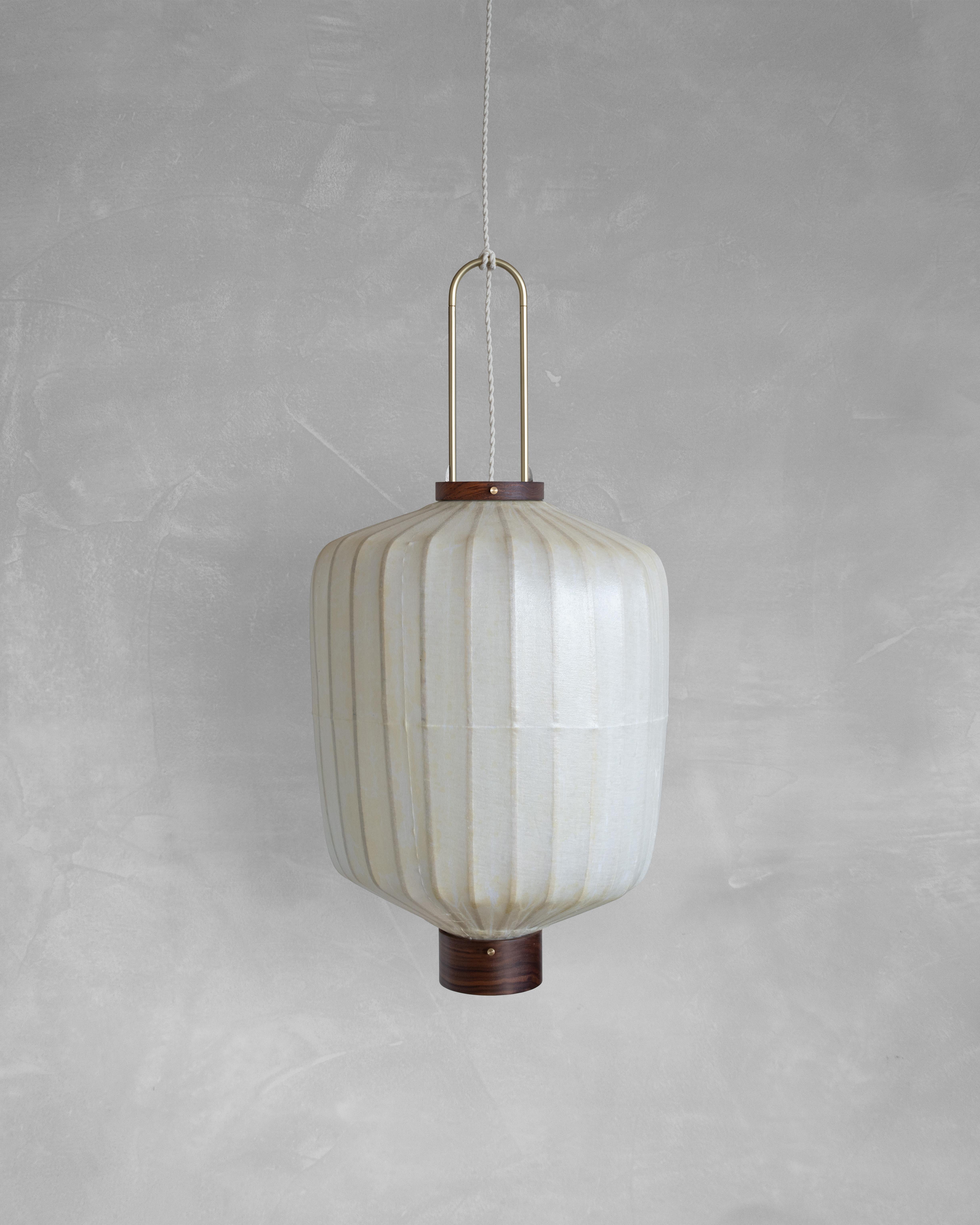 HU02B Pendant Lamp L by Taiwan Lantern
Dimensions: D 42 x W 42 x H 52 cm.
Material: Walnut & bamboo frame, Hand-colored fabrics, Metal pipes, Leather lace, Handmade porcelain ceiling cap.


This brown color is inspired by Wu Xing 五行. Brown presents