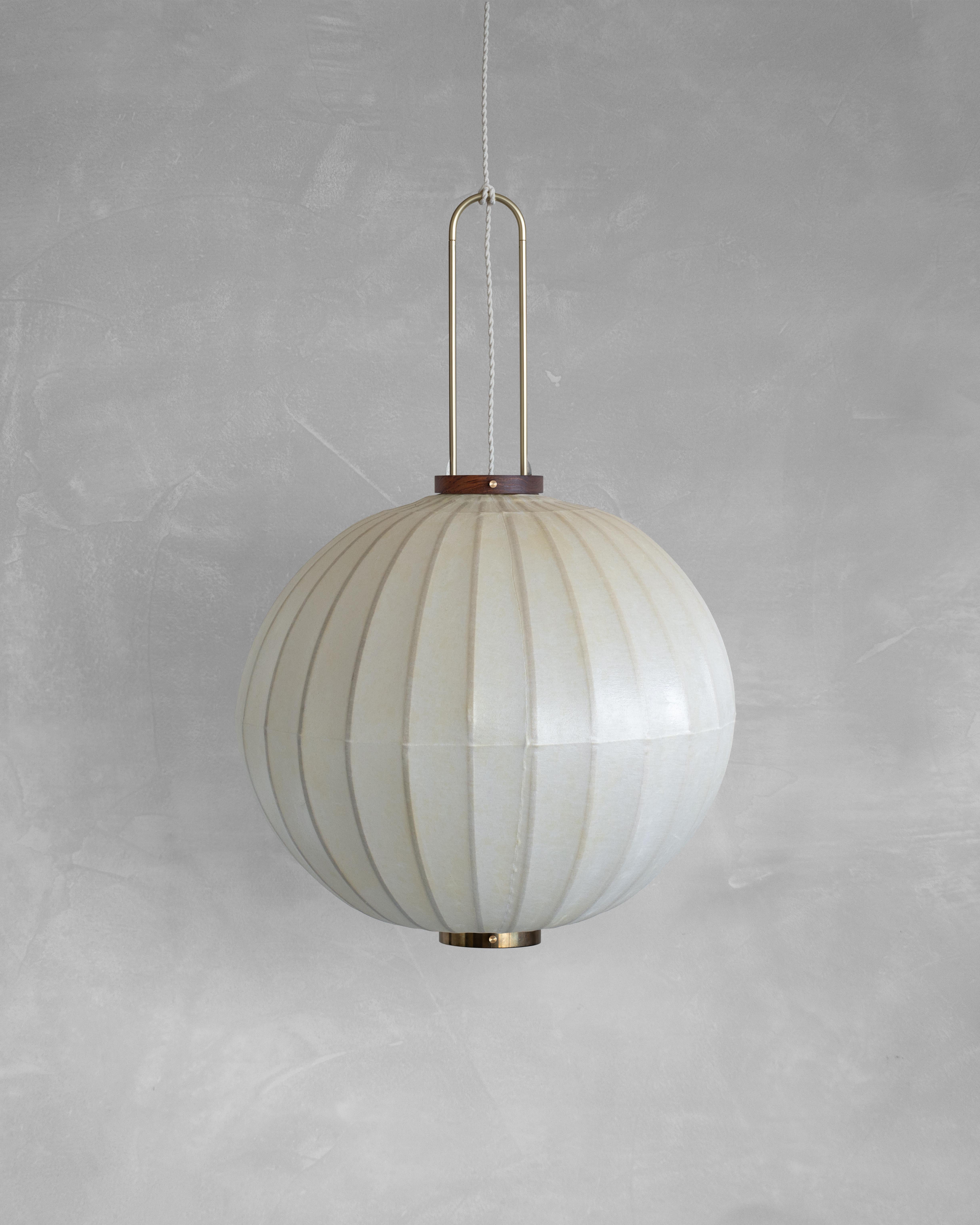 HU02M Pendant Lamp L by Taiwan Lantern
Dimensions: D 57 x W 57 x H 50 cm.
Material: Walnut & bamboo frame, Hand-colored fabrics, Metal pipes, Leather lace, Handmade porcelain ceiling cap.


This brown color is inspired by Wu Xing 五行. Brown presents