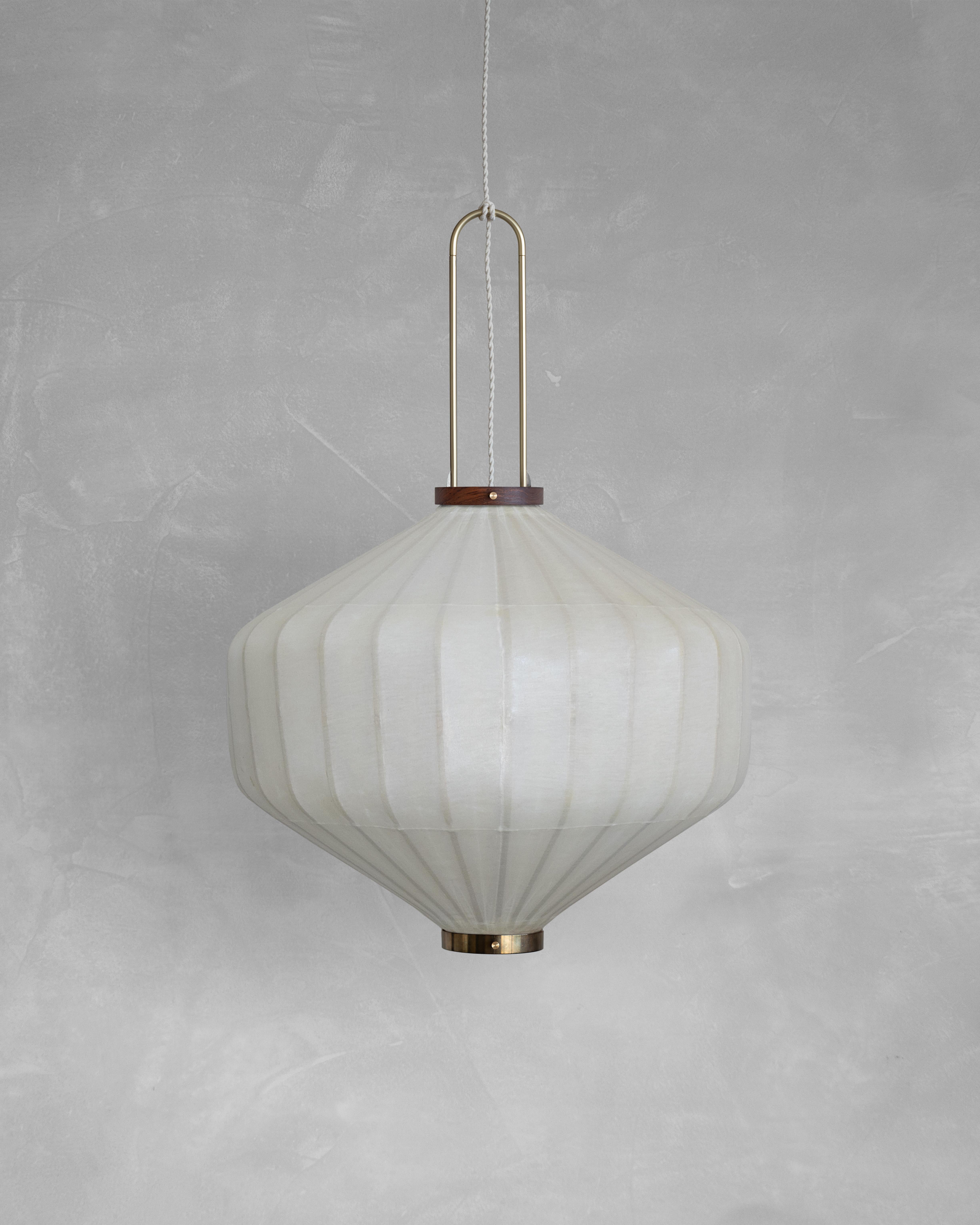 HU02M Pendant Lamp XL by Taiwan Lantern
Dimensions: D 65 x W 65 x H 55 cm.
Material: Walnut & bamboo frame, Hand-colored fabrics, Metal pipes, Leather lace, Handmade porcelain ceiling cap.


This brown color is inspired by Wu Xing 五行. Brown presents