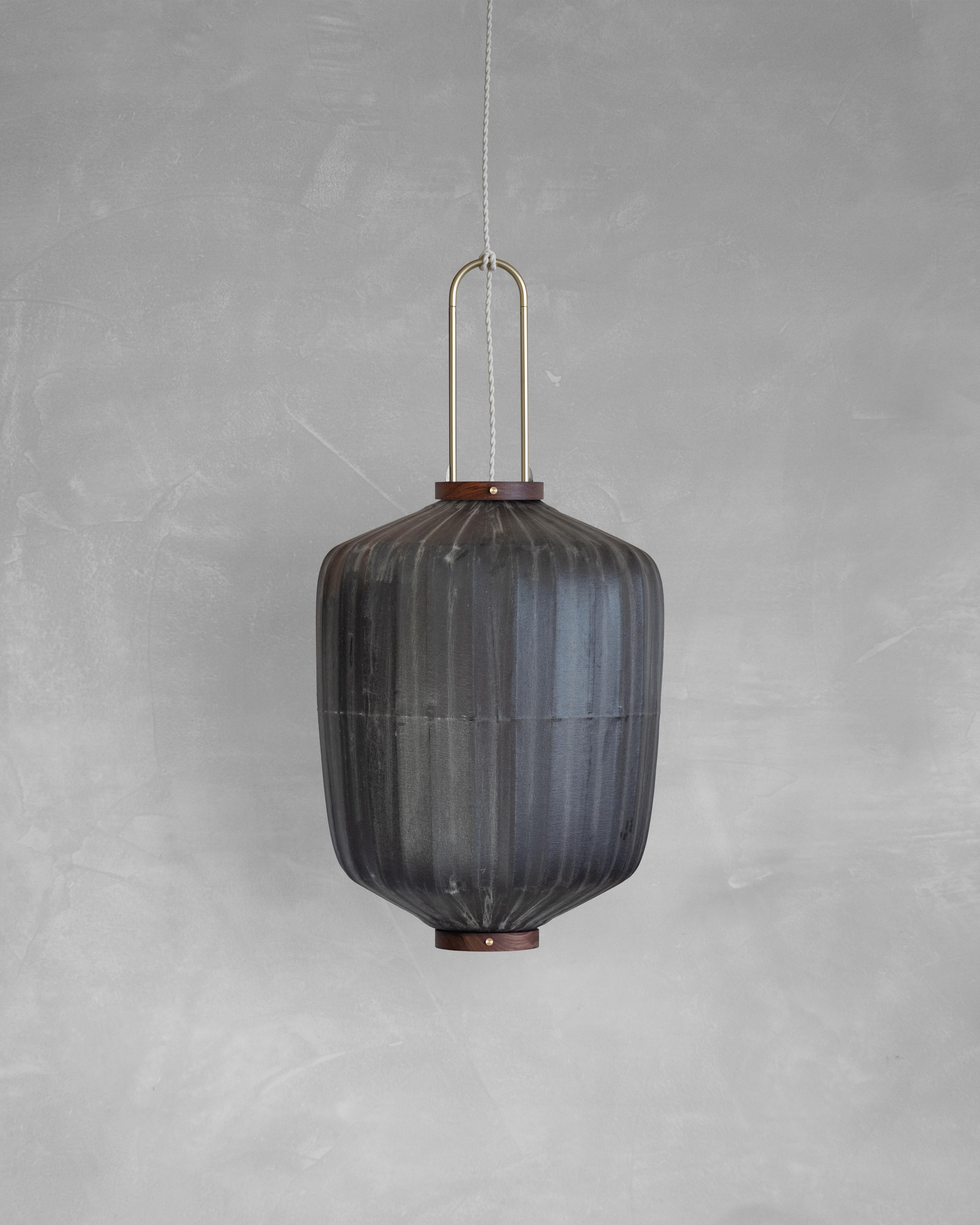 HU03B Pendant Lamp L by Taiwan Lantern
Dimensions: D 42 x W 42 x H 52 cm.
Material: Walnut & bamboo frame, Hand-colored fabrics, Metal pipes, Leather lace, Handmade porcelain ceiling cap.


This brown color is inspired by Wu Xing 五行. Brown presents