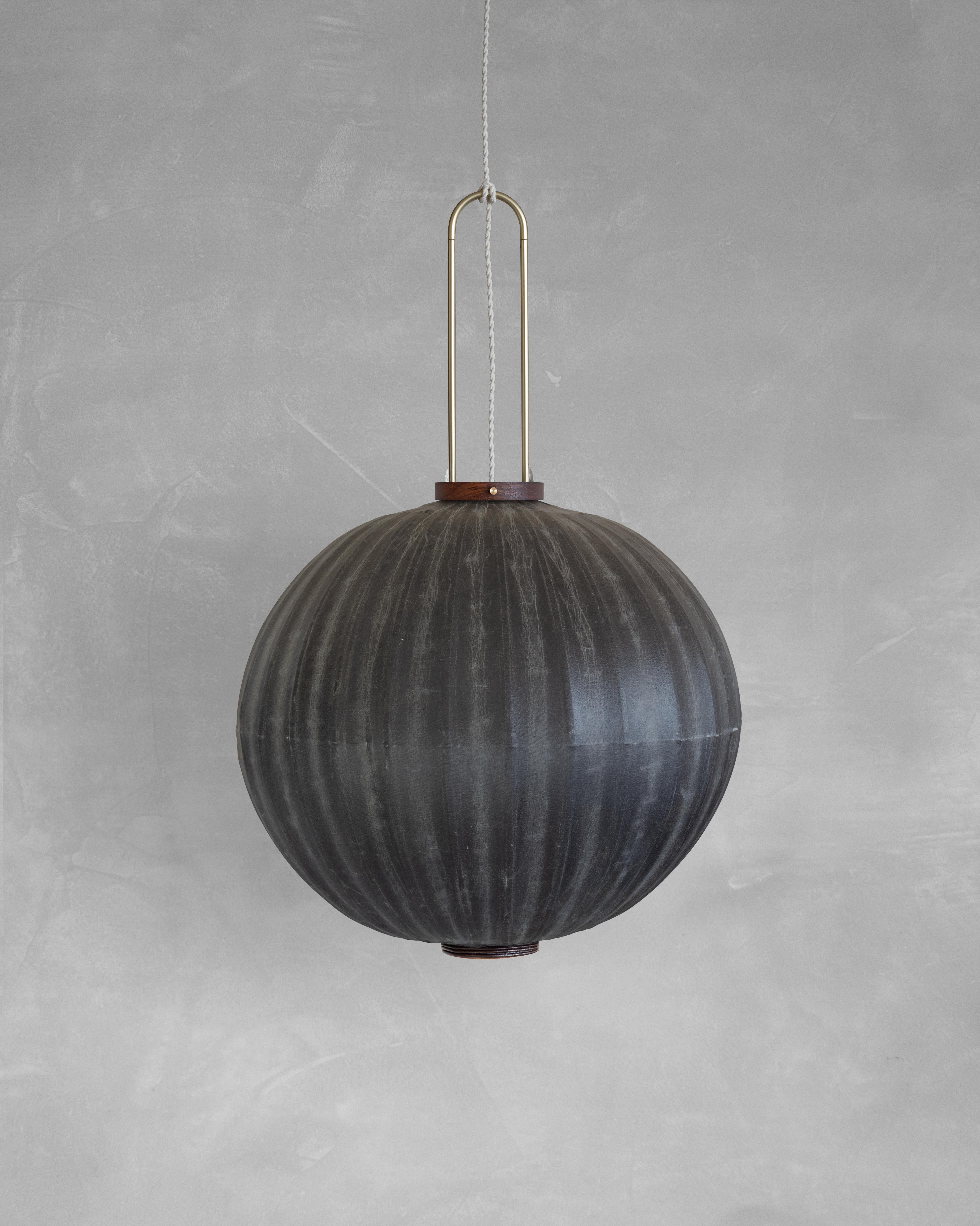 HU03M Pendant Lamp L by Taiwan Lantern
Dimensions: D 57 x W 57 x H 50 cm.
Material: Walnut & bamboo frame, Hand-colored fabrics, Metal pipes, Leather lace, Handmade porcelain ceiling cap.


This brown color is inspired by Wu Xing 五行. Brown presents