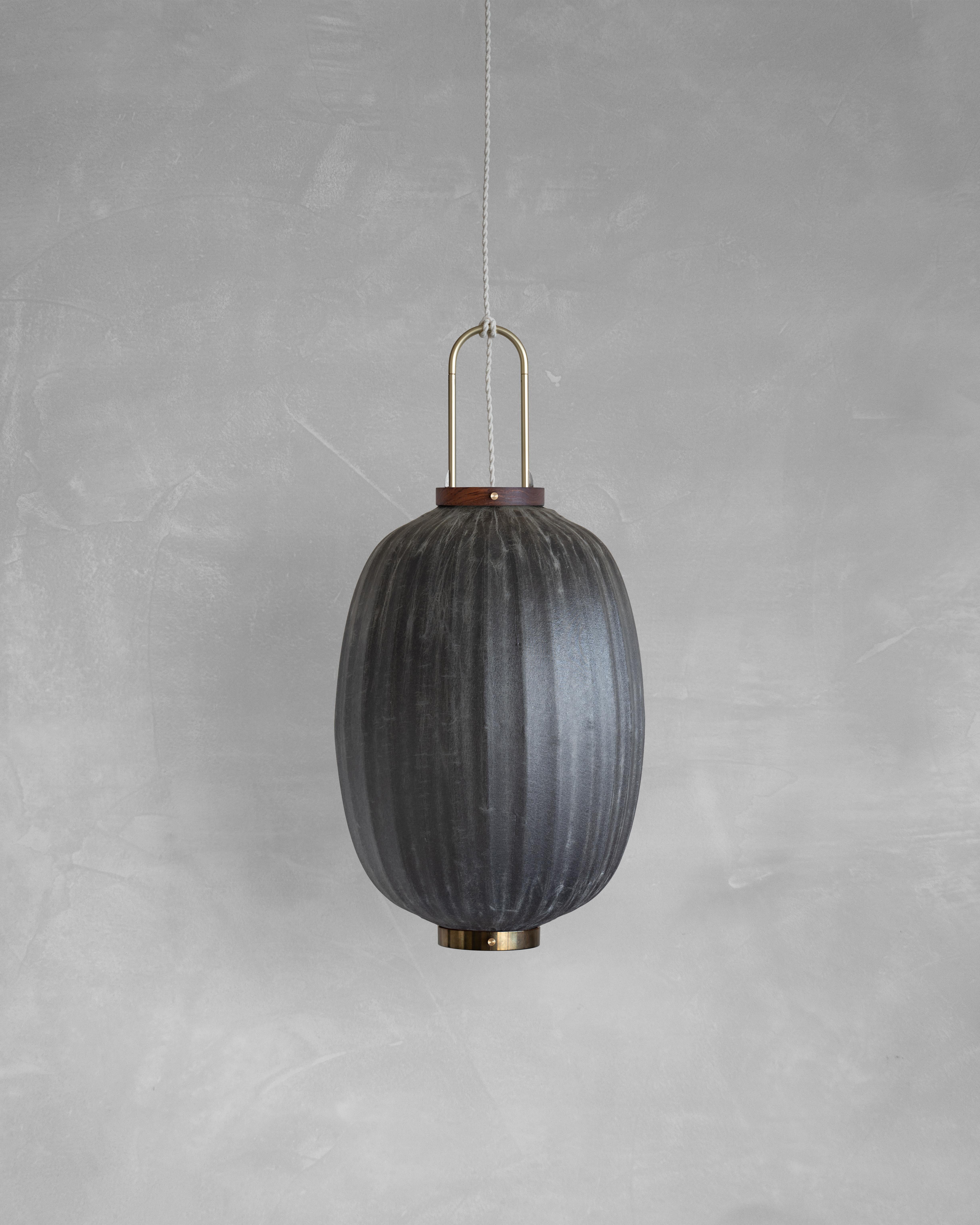 HU03O Pendant Lamp L by Taiwan Lantern
Dimensions: D 35 x W 35 x H 49 cm.
Material: Walnut & bamboo frame, Hand-colored fabrics, Metal pipes, Leather lace, Handmade porcelain ceiling cap.


This brown color is inspired by Wu Xing 五行. Brown presents