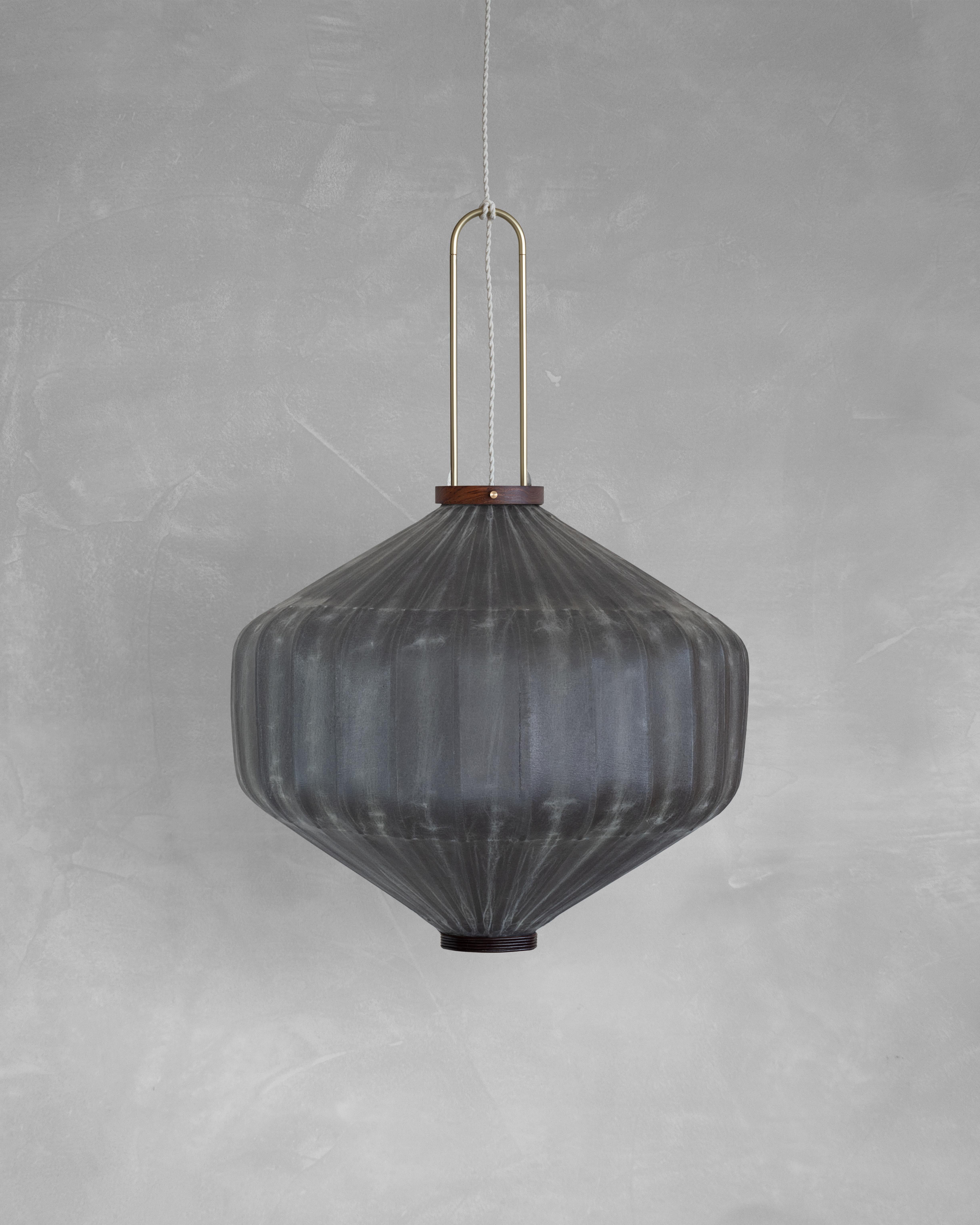 HU03T Pendant Lamp L by Taiwan Lantern
Dimensions: D 57 x W 57 x H 50 cm.
Material: Walnut & bamboo frame, Hand-colored fabrics, Metal pipes, Leather lace, Handmade porcelain ceiling cap.


This brown color is inspired by Wu Xing 五行. Brown presents
