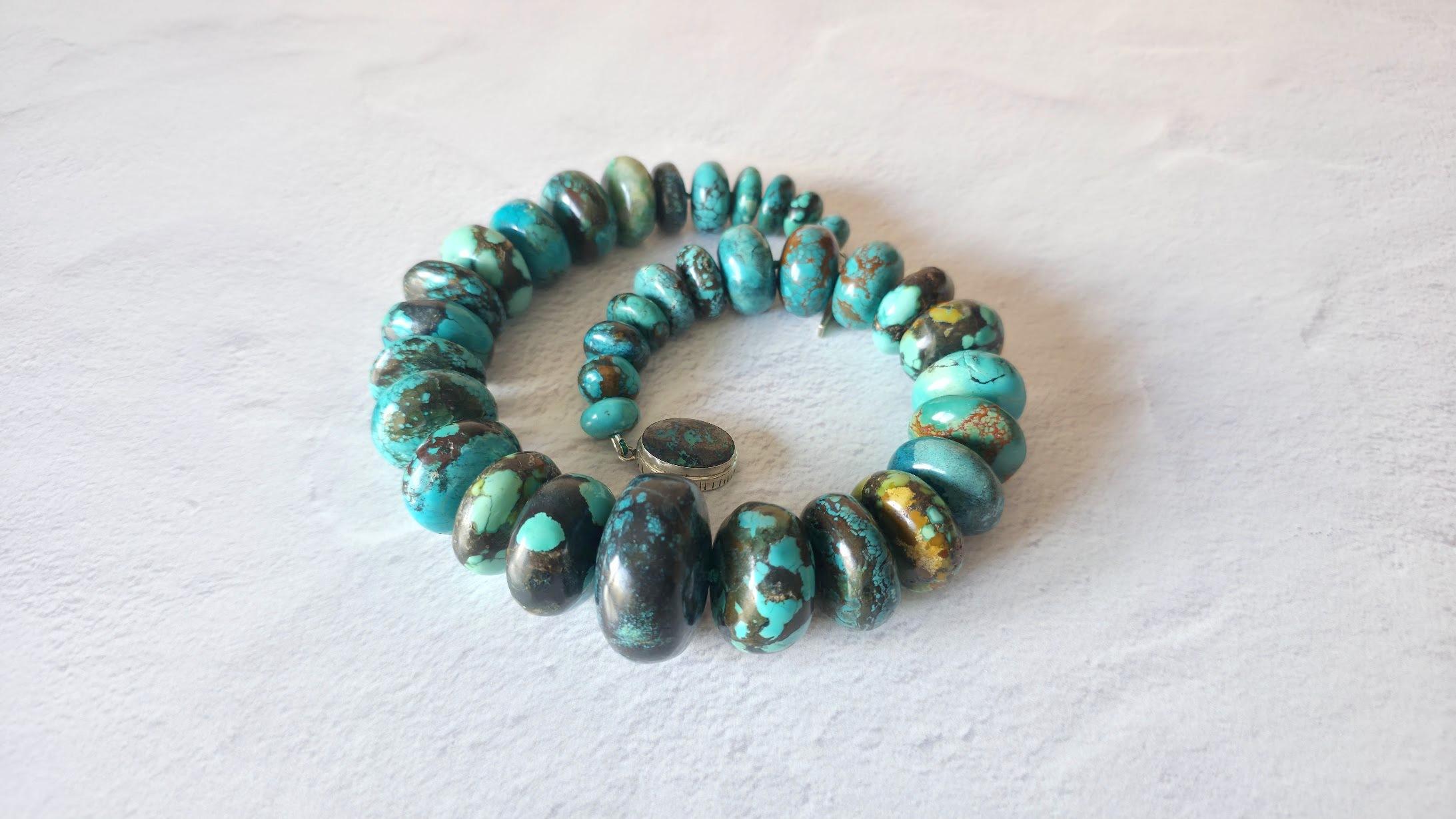 Allow us to present a stunning, large, and exceptionally rare necklace crafted from natural turquoise.
The length of the necklace is 21.5 inches (54.5 cm). The size of the rondelle beads varies from 16 mm to 40 mm.
Turquoise ranges in color from a