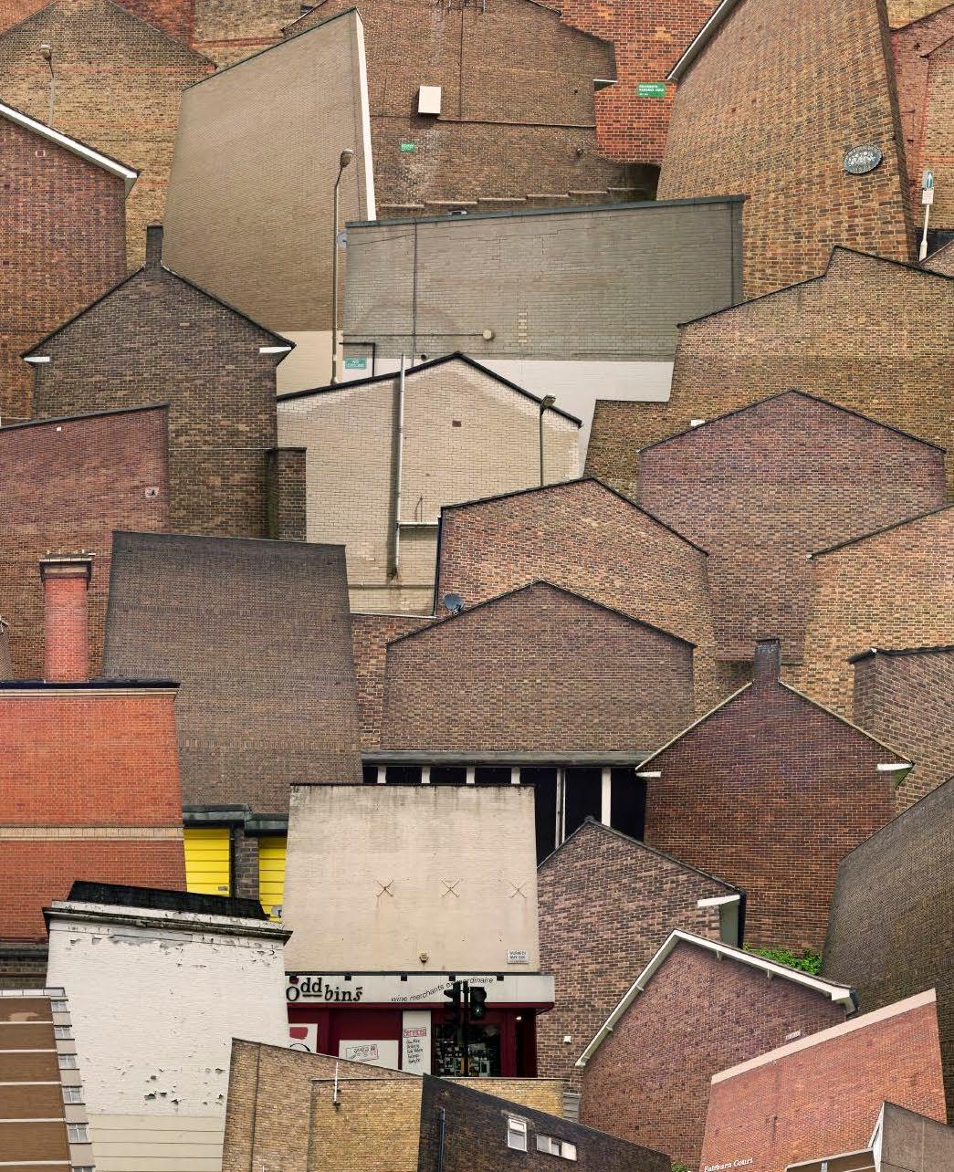 Home Seekers 5 - 21st Century Color Architectural Brick Photography London - Brown Landscape Photograph by Hubert Blanz