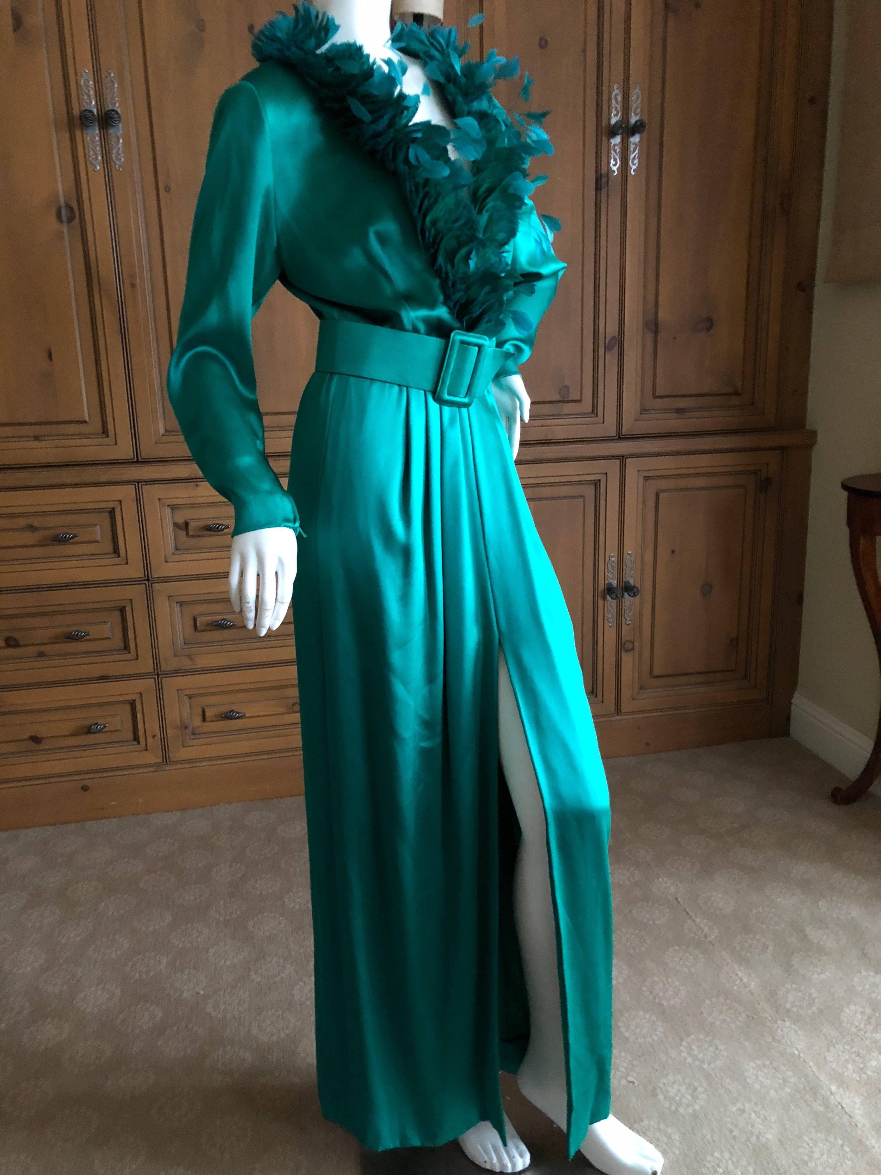 Hubert de Givenchy 1970's Emerald Green Silk Evening Dress with Maison Lemaire Feather Trim.
 Low cut bust with a leather lined silk belt, this is stunning, much prettier than the photos show. High side slit.
There is no size tag, from measurements