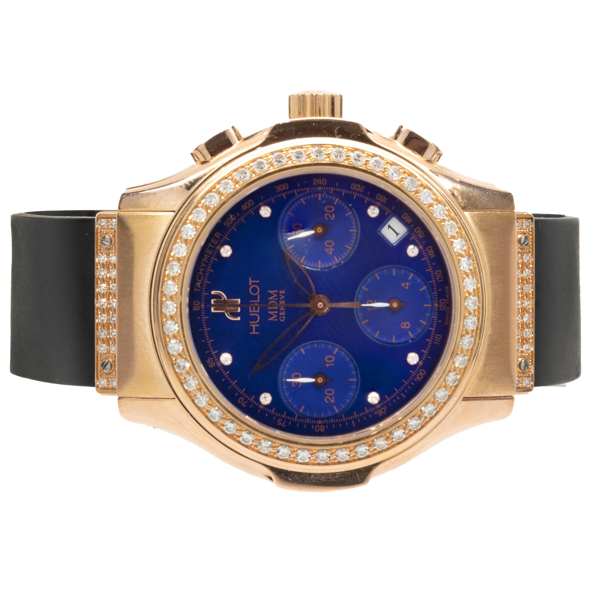 Movement: automatic
Function: hours, minutes, seconds, date, chronograph
Case: 40mm 18K rose gold round case, diamond bezel
Band: black rubber Hublot strap with deployment clasp
Dial: electric blue sunburst
Reference #:  MDM 1810.810.3.054
Serial #: