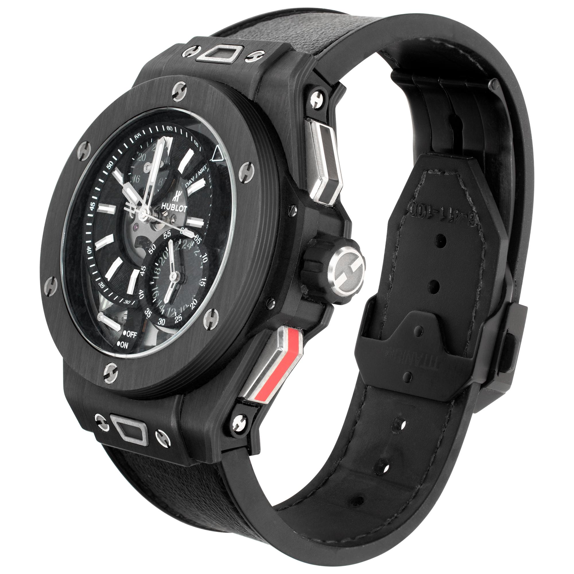 Hublot Big Bang Alarm Repeater GMT Yoshida 100th Anniversary in carbon fiber on a black calfskin over rubber strap with Hublot PVD deployant buckle. Manual w/ sweep seconds, GMT, day/night indicator and alarm. 45 mm case size. With additional velcro