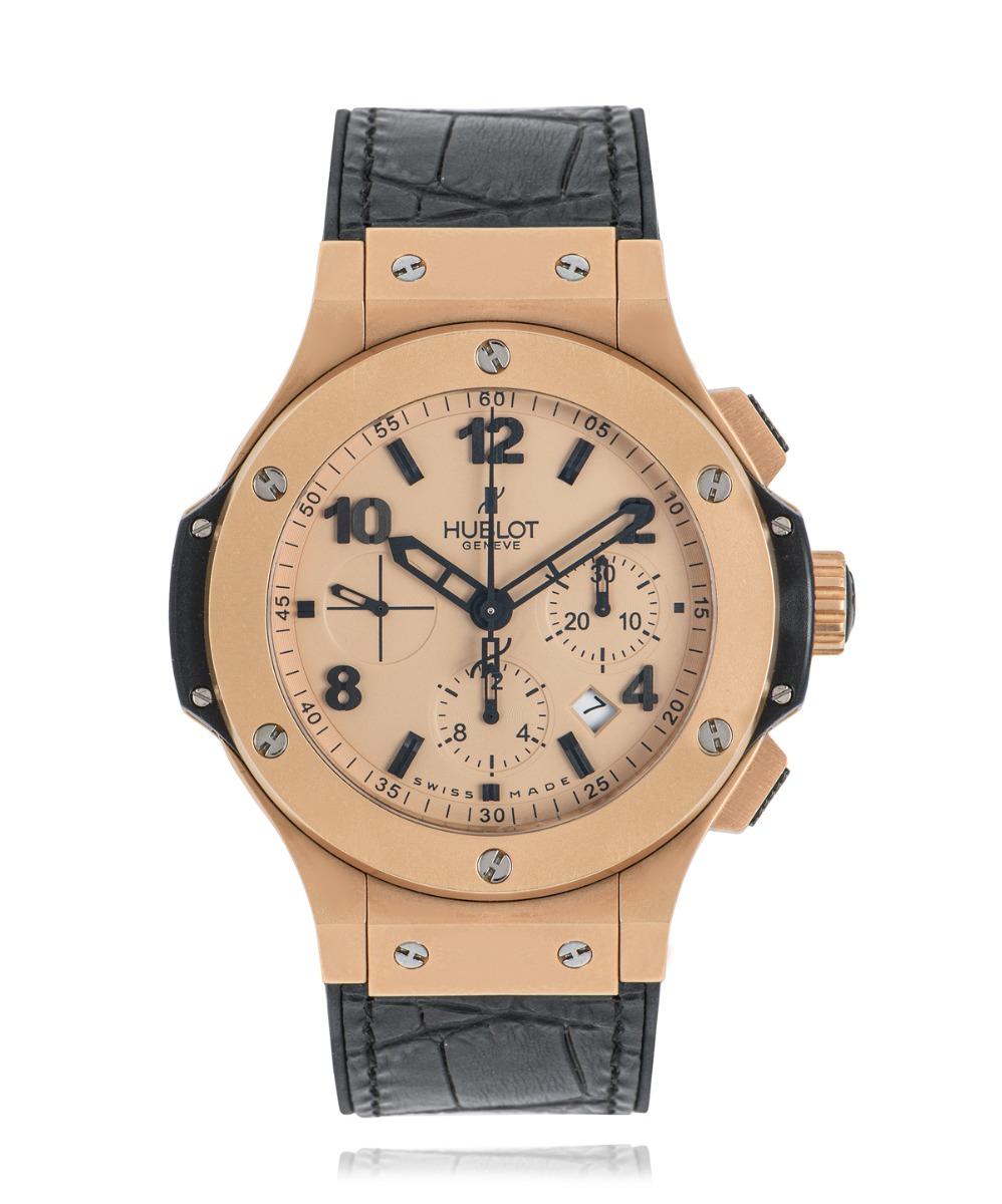 A men's 18k rose gold Big Bang wristwatch 44.5mm by Hublot. Features a distinctive rose gold dial with arabic applied numbers, 3 subdials displaying a 30 minute, 60 second, 12 hour markers, and a date. Complementing the dial is a fixed rose gold