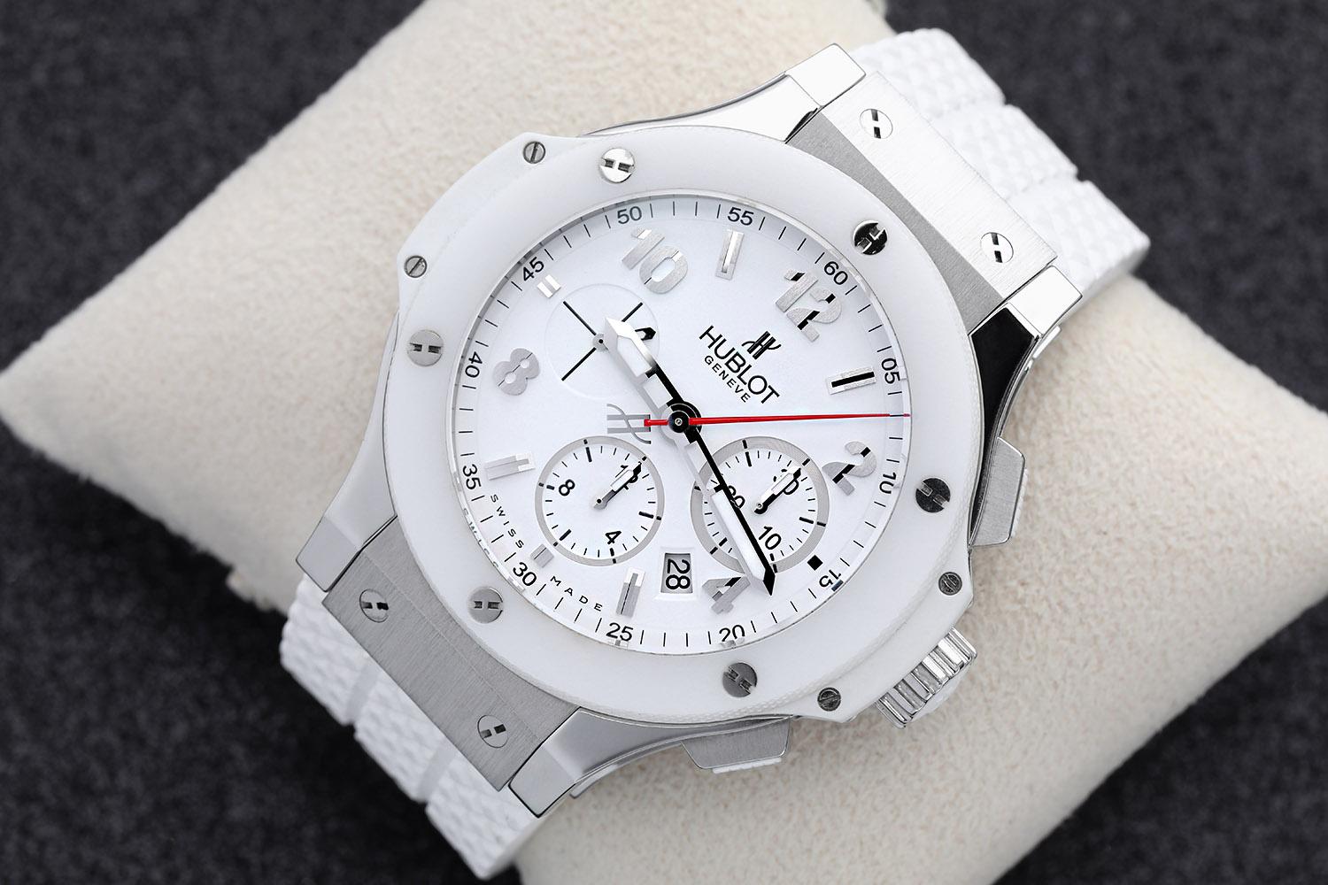 Watch has absolutely NO visible scratches or blemishes. It is in MINT CONDITION. Comes with Hublot Box and Papers. Stainless steel case with a white rubber strap. Fixed white ceramic bezel. White dial with luminous silver-tone skeleton hands and