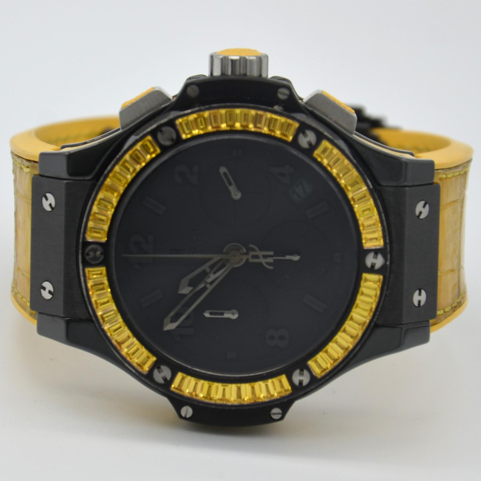 41mm black ceramic case, PVD white gold bezel set with 48 baguette yellow sapphires, matt black dial, self winding HUB 4300 movement with chronograph function, approximately 42 hours of power reserve, yellow rubber-alligator strap with deployant