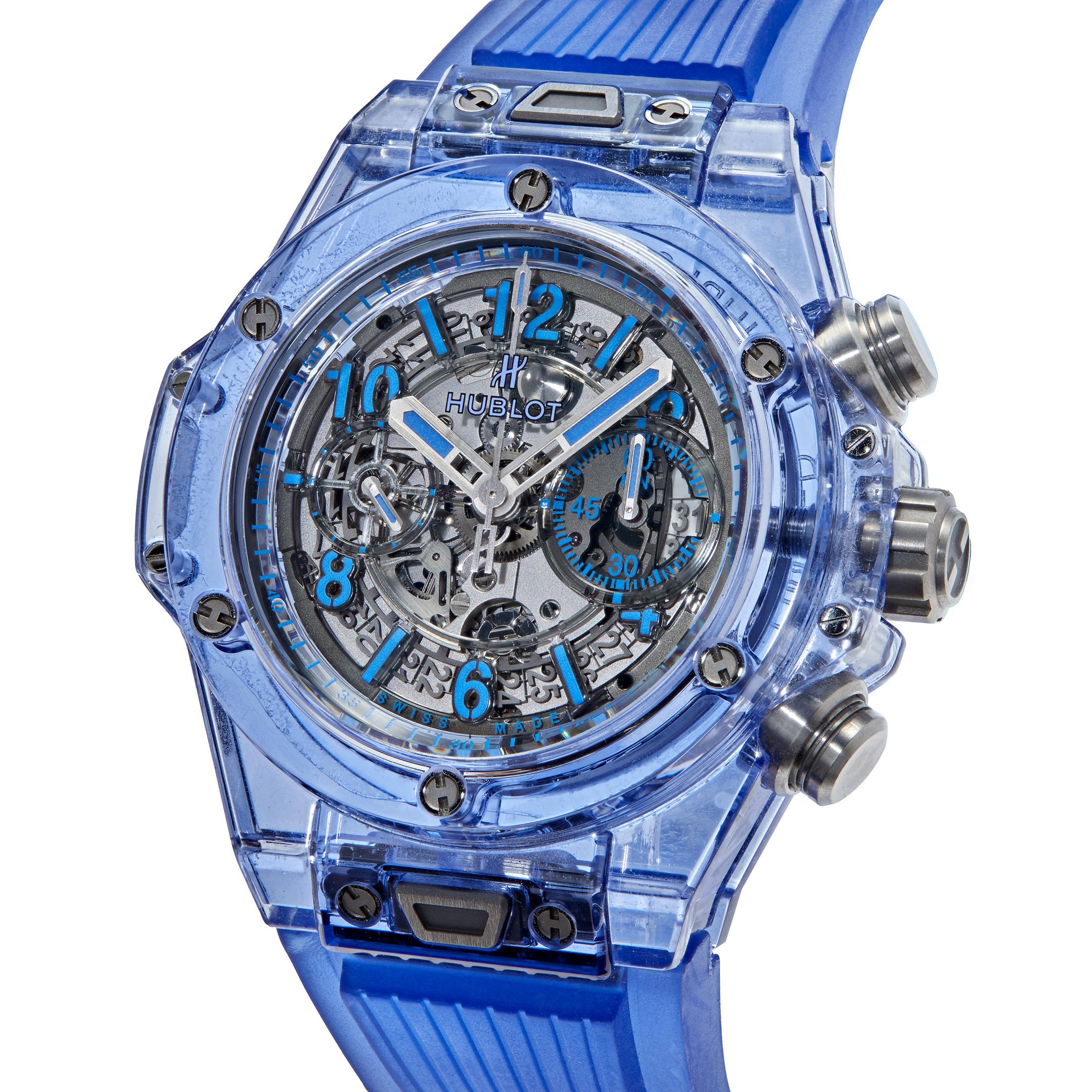 Introducing the Hublot Big Bang Unico Blue Sapphire 411.JL.4809.RT; This unique timepiece features a clear blue rubber strap and a transparent blue sapphire crystal casing. The bezel is made of translucent blue sapphire crystal and is fixed. It