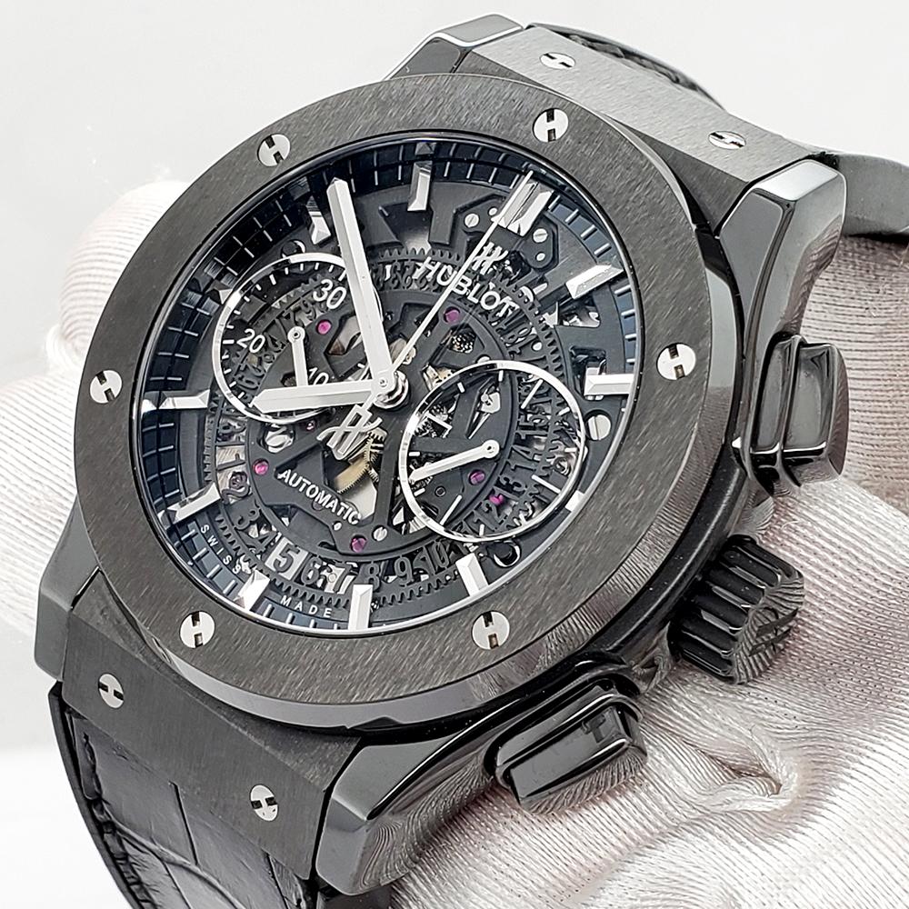 Hublot Classic Fusion Aerofusion 45mm Chronograph Black Magic Ceramic Skeleton Watch, Ref 525.CM.0170.RX

Comes with Hublot box and ElegantSwiss Watch Co Three Year Warranty. Very good condition, signs of wear marks on strap, the watch is running