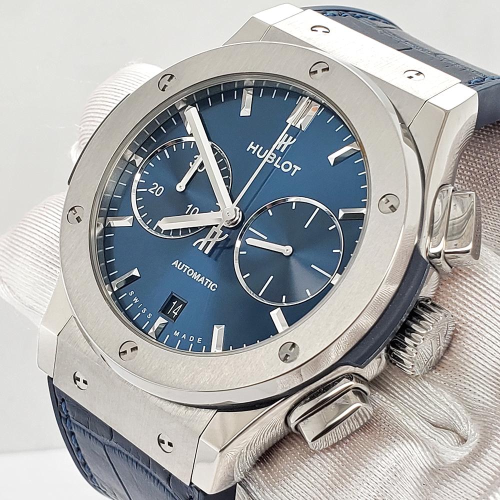 Hublot Classic Fusion Chronograph 45mm Titanium Blue Dial Watch, Ref 521.NX.7170.LR.

Excellent, pristine condition, works flawlessly. The watch is running strong and keeping accurate time, having been timed to precision on Witschi Expert Timing