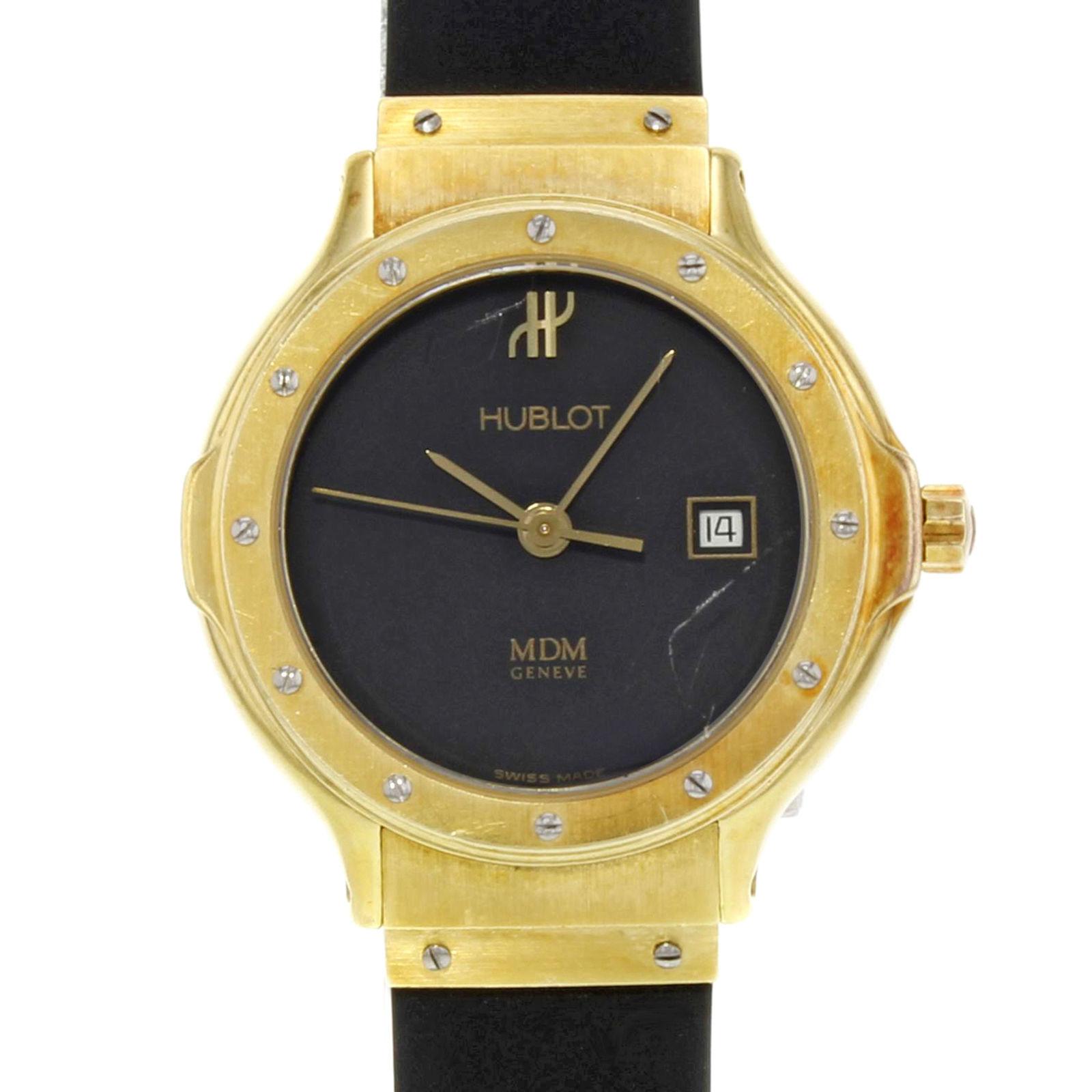 (32776)

This pre-owned Hublot MDM 1391.3 is a beautiful Ladies timepiece that is powered by a quartz movement which is cased in a yellow gold case. It has a round shape face, date dial and has hand unspecified style markers. It is completed with a