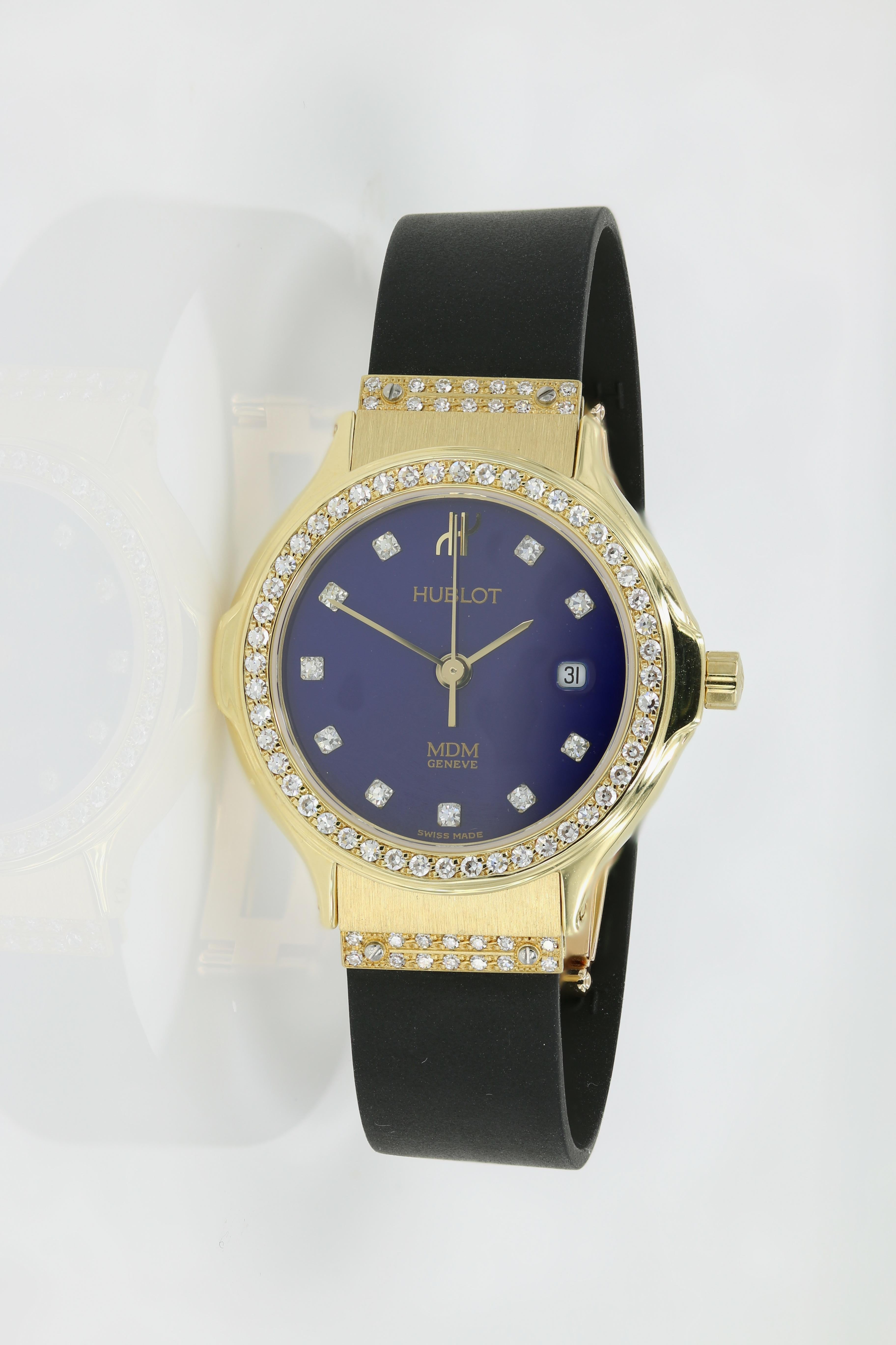 Hublot Watch - Ladies 18kt Yellow Gold with Diamonds (Pre-owned).  - Diamond bezel, markers & lugs (abt. 0.54ct) Blue Dial on new Rubber straps w/Deployment clasp - Fully restored at Hublot USA. Strap sizes are 139.10.61