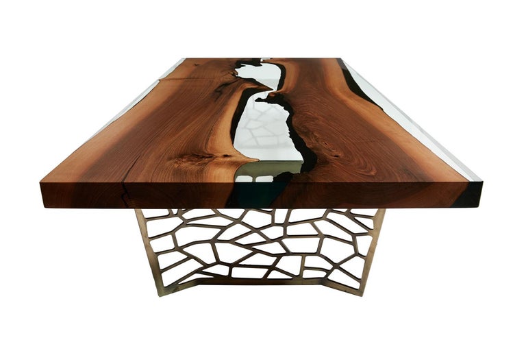 The ‘Hudson 180 Resin Coffee Table’ was made in Ankara, Turkey with walnut wood. The wood is kilned and dried prior to being filled with high quality resin and has cast iron geometric legs. Its edges are straight cut to show the depth of the wood