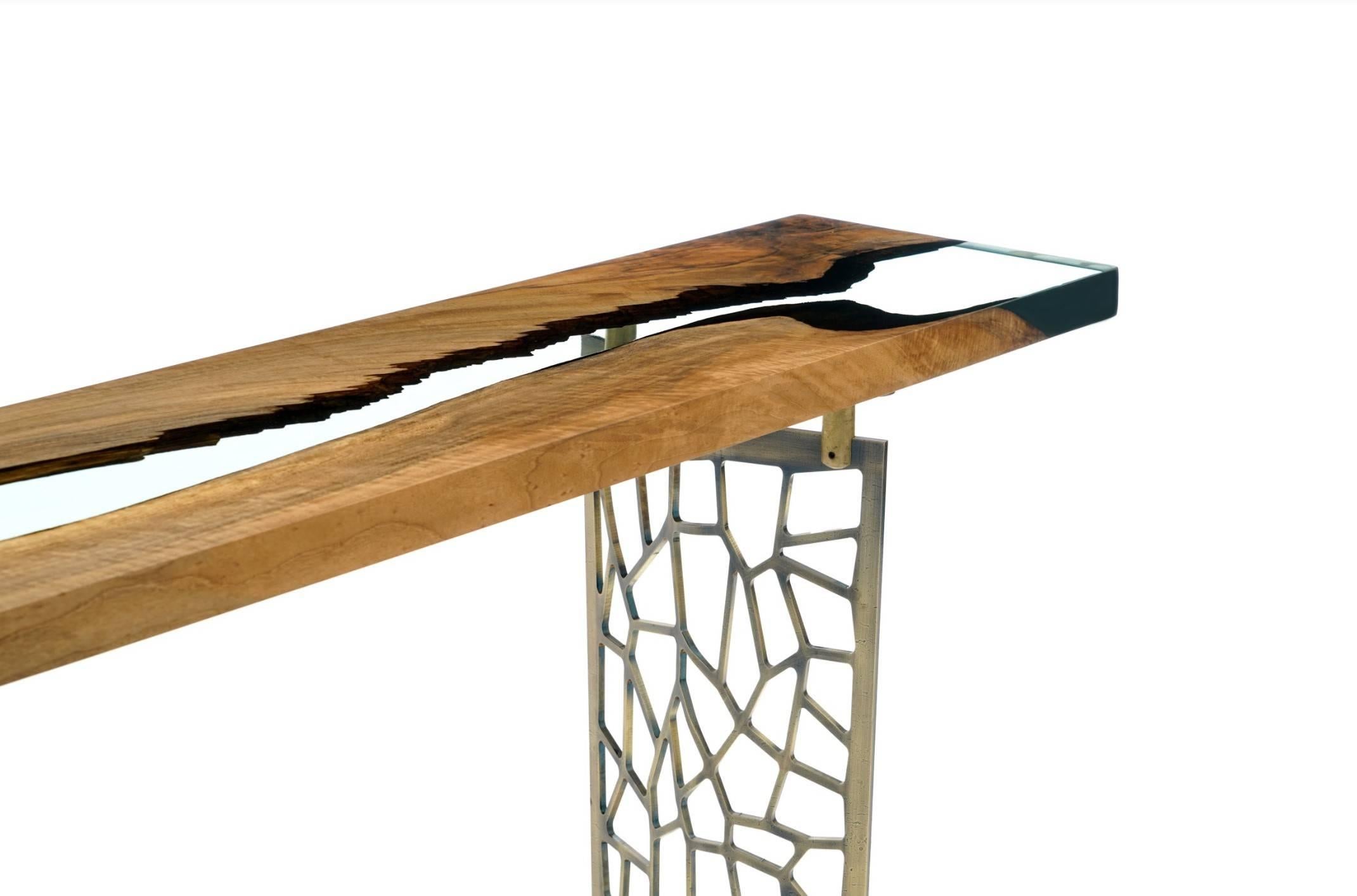 The ‘Hudson 200 Resin Console’ was made in Ankara, Turkey with walnut wood cut into straight edges. It is kilned and dried prior to being filled with high quality resin and placed on steel base. This particular piece is ideal for entryways!