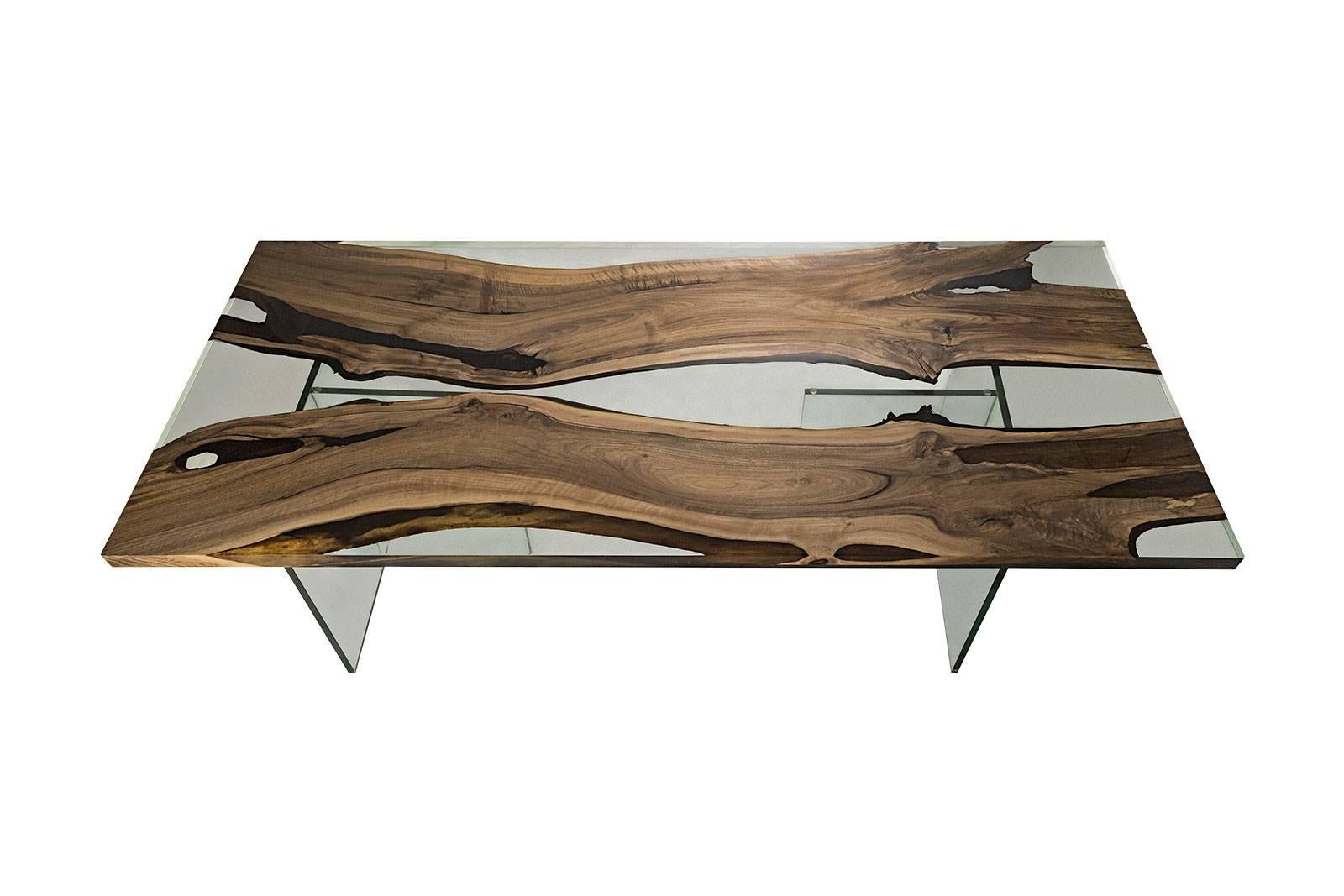 The ‘Hudson 250 Resin Dining Table’ was made in Ankara, Turkey with walnut wood. The wood is kilned and dried prior to being filled with high quality resin and has cast iron geometric legs. Its edges are straight cut to show the depth of the wood