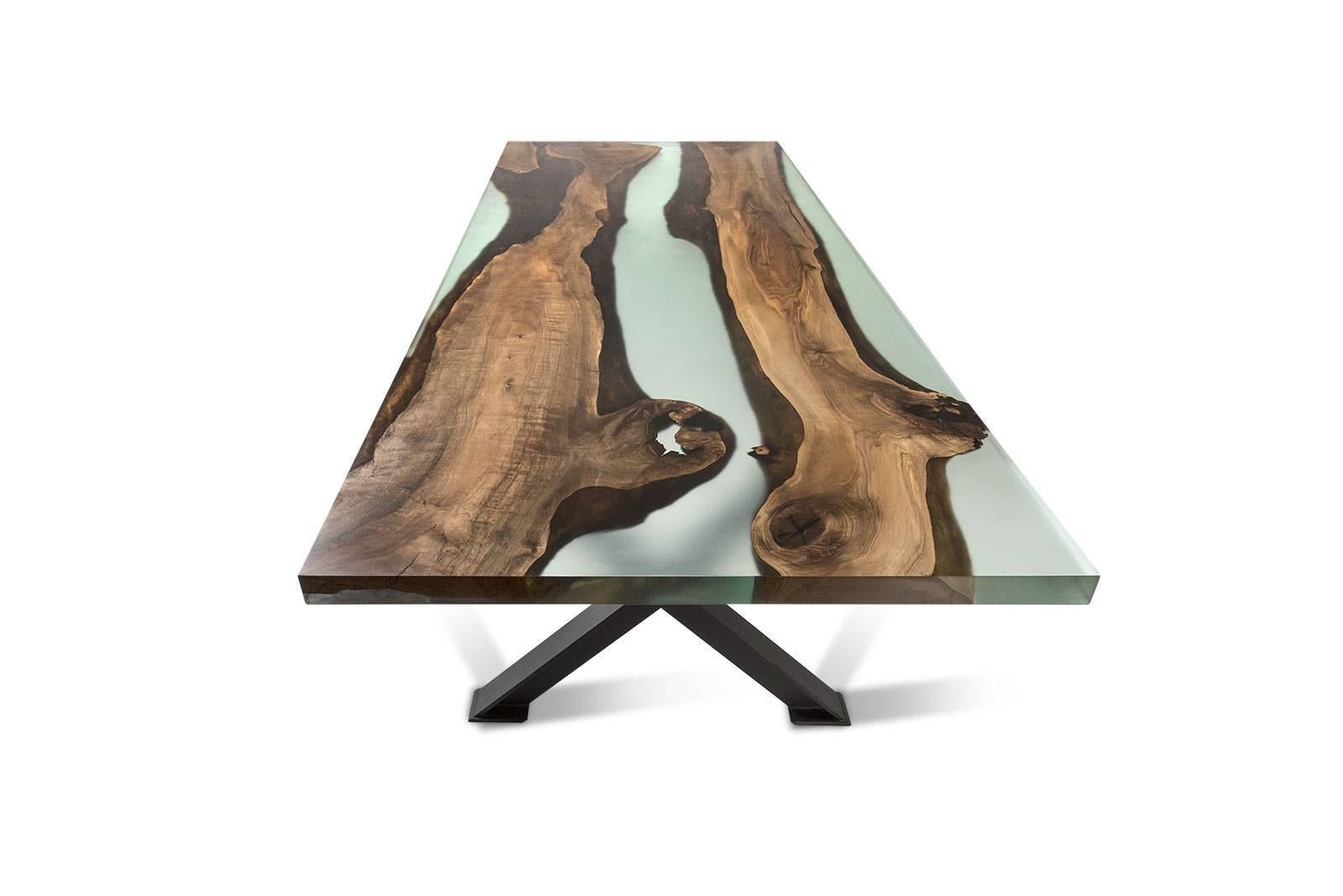 The ‘Hudson 250 Epoxy Resin Dining Table’ was made in Ankara, Turkey with walnut wood. The wood is kilned and dried prior to being filled with high quality resin and has cast iron geometric legs. Its edges are straight cut to show the depth of the