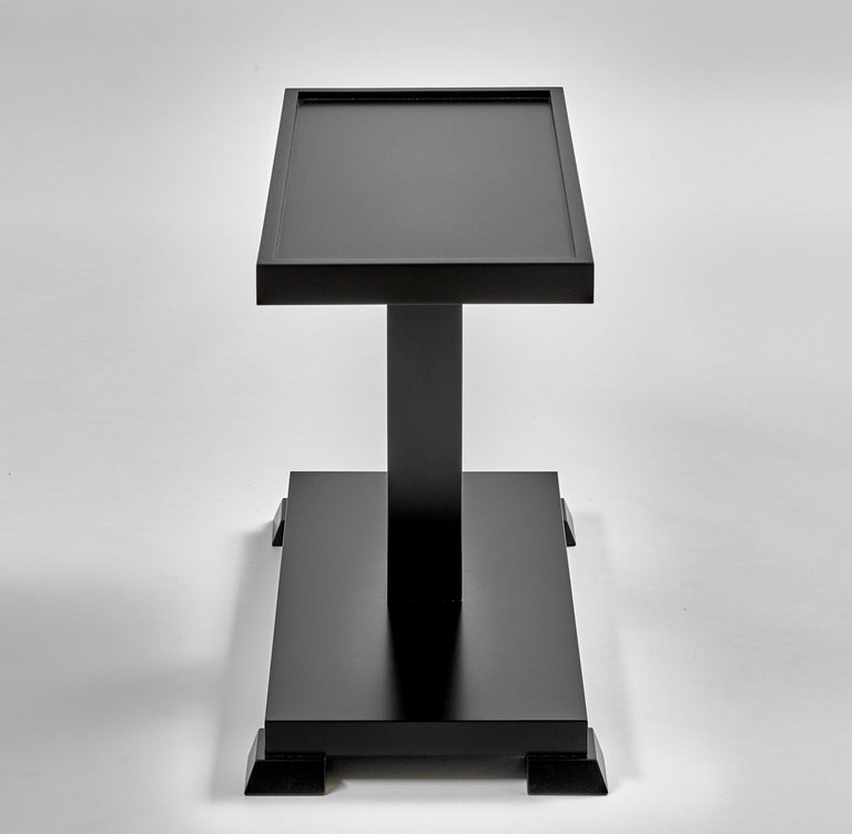 Contemporary black side end table with footed base. Perfectly scaled to fit any room decor.
Dimensions: 22