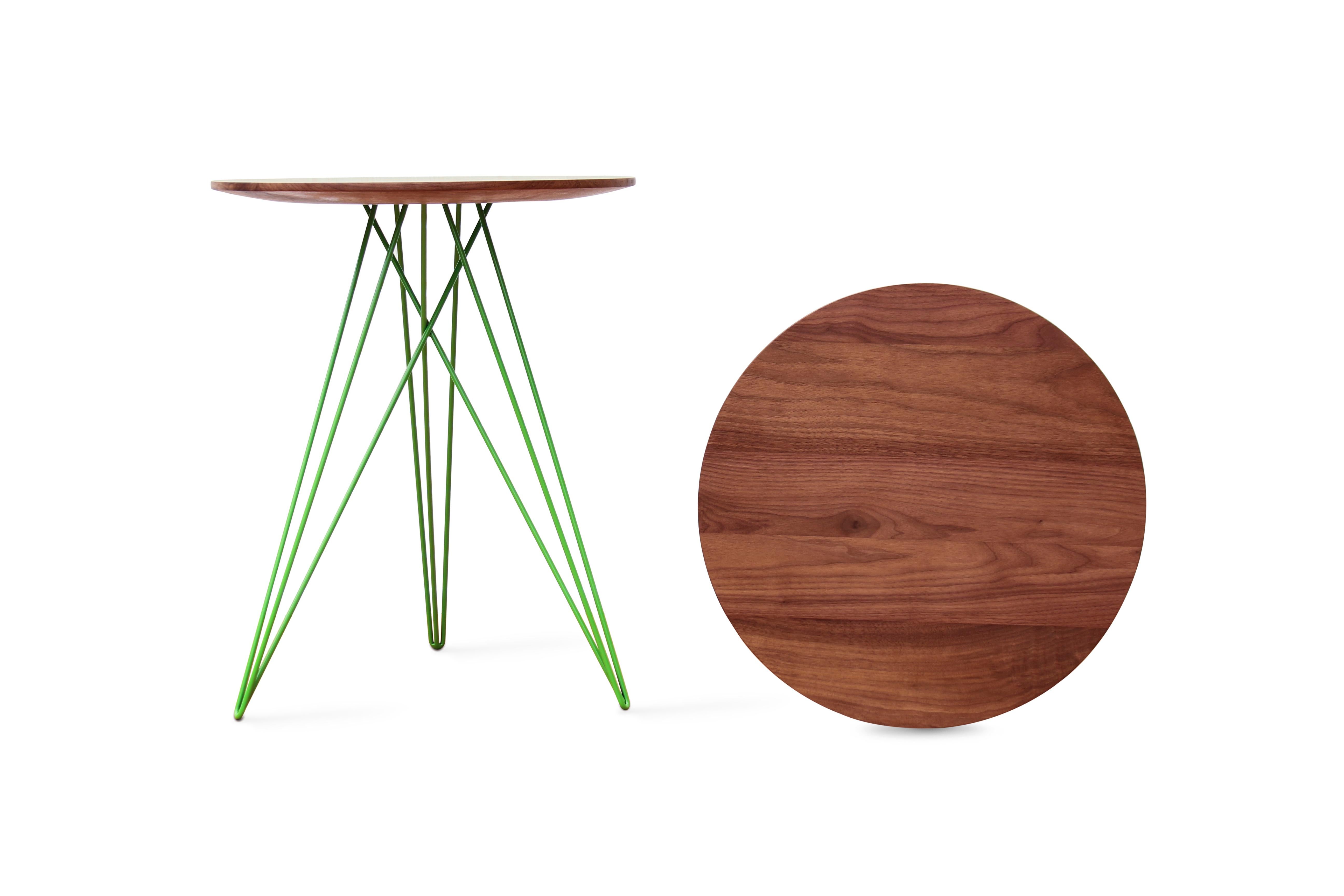 This eye-catching piece combines an industrial structure with sophisticated modern accents. The intersecting metal legs almost seem to play tricks on the eyes and change shape as you circle around the table. It is finished with a slim and elegantly