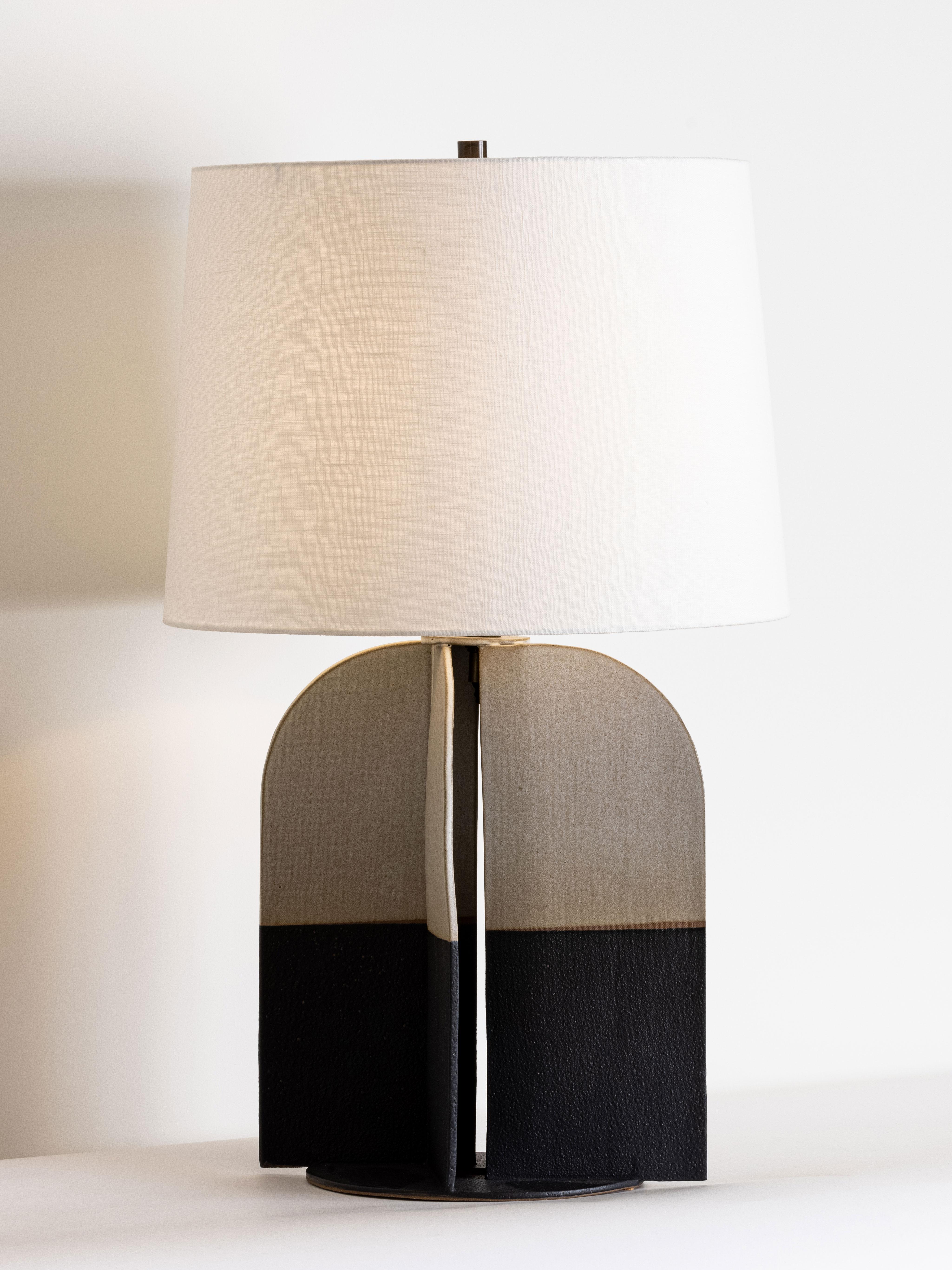 Our stoneware Hudson Lamp is handcrafted using slab-construction techniques.

Finish

- Dipped glaze, pictured in matte-black & parchment 
- Antique brass fittings
- Twisted beige-cloth cord
- Full-range dimmer socket
- Off-white linen