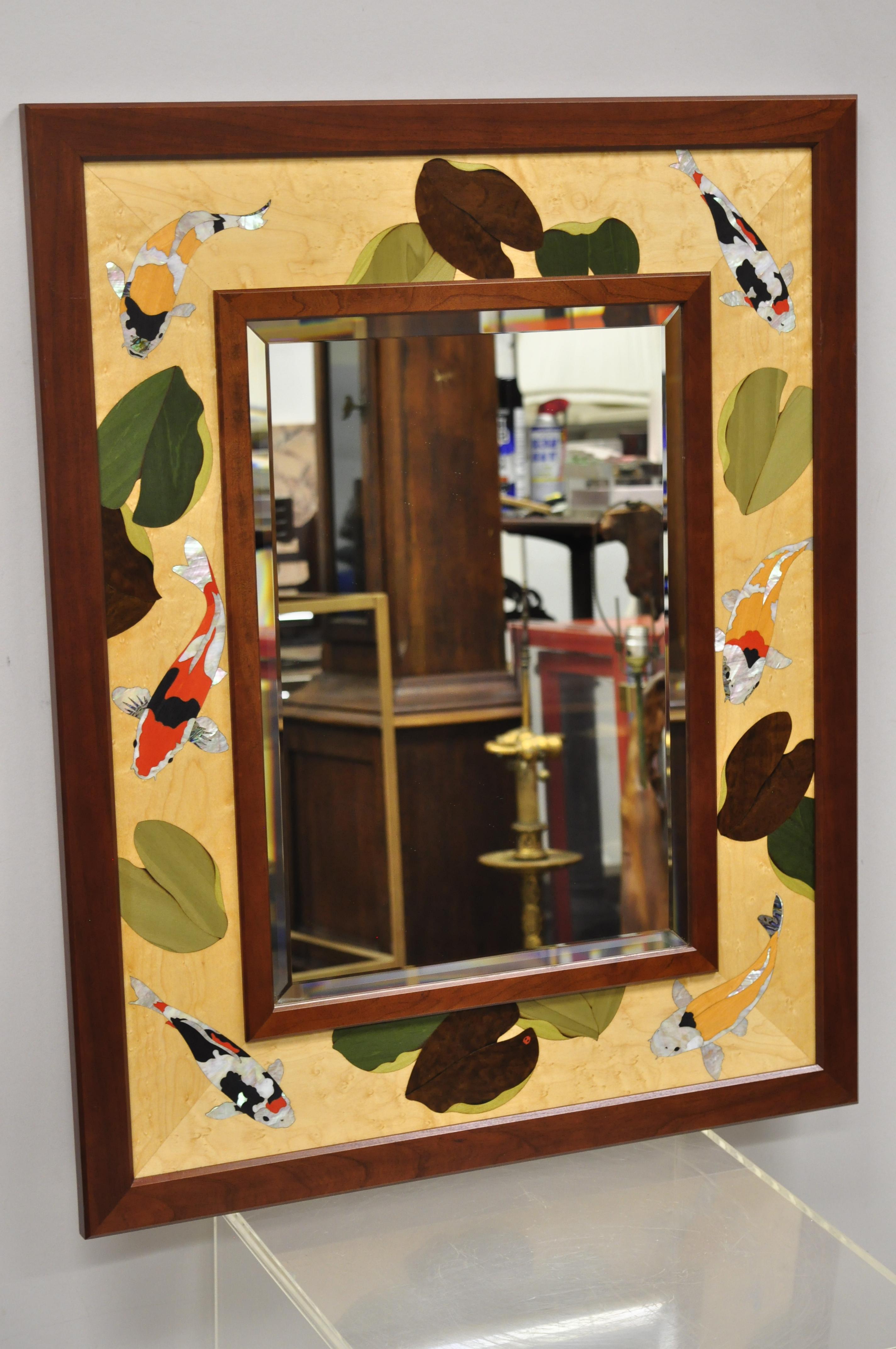 Hudson River inlay marquetry inlaid koi fish lily pond beveled glass mirror. Item features multiple wood inlays and mother of pearl, all done by hand. Beveled glass mirror, solid wood frame, beautiful wood grain, quality craftsmanship, great style