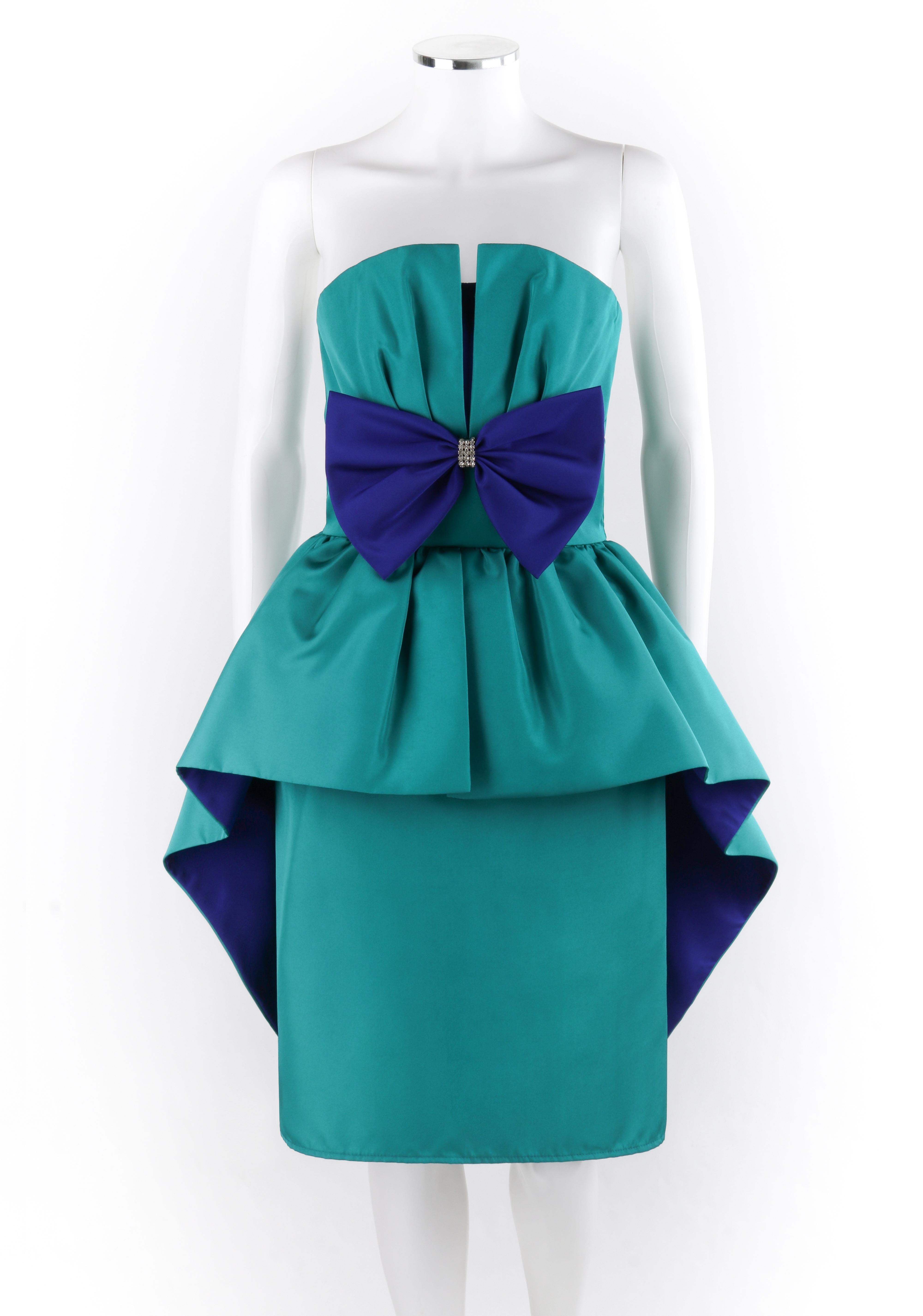 HUEY WALTZER c.1980’s Teal Purple Dual Tone Pleated Peplum Strapless Party Dress
Circa: 1980’s
Label(s): Huey Waltzer for Darcy
Designer: Huey Waltzer
Style: Sleeveless dress
Color(s): Teal and purple
Lined: Partial
Unmarked Fabric Content (feel