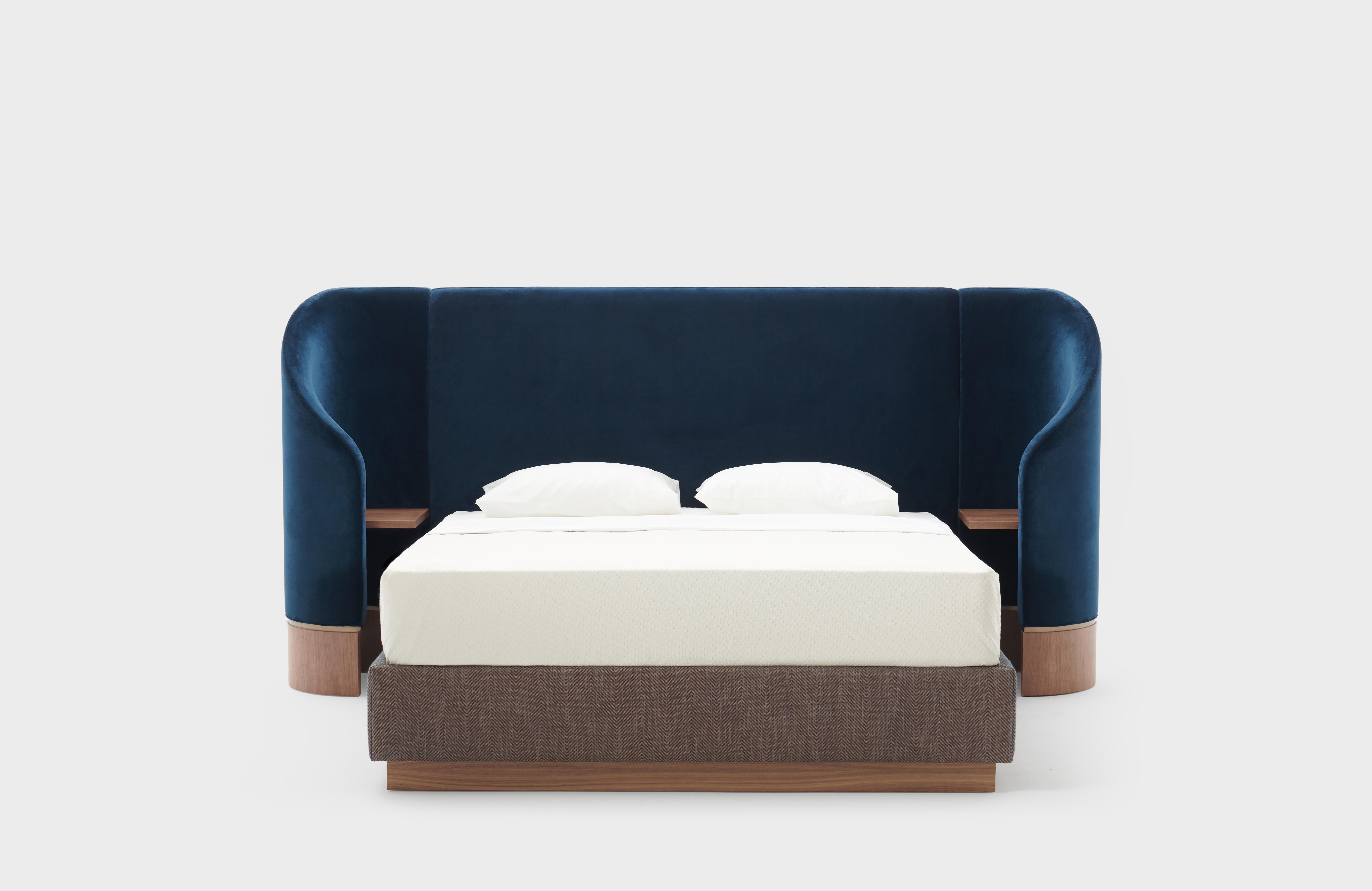Hug Bed embraces its night time dwellers as they drift asleep within the sanctuary of its wings. 

Inspired by the reflection of the clear night sky against a calm lake, the navy blue fabric mimics the deep relaxing feeling of being in nature.