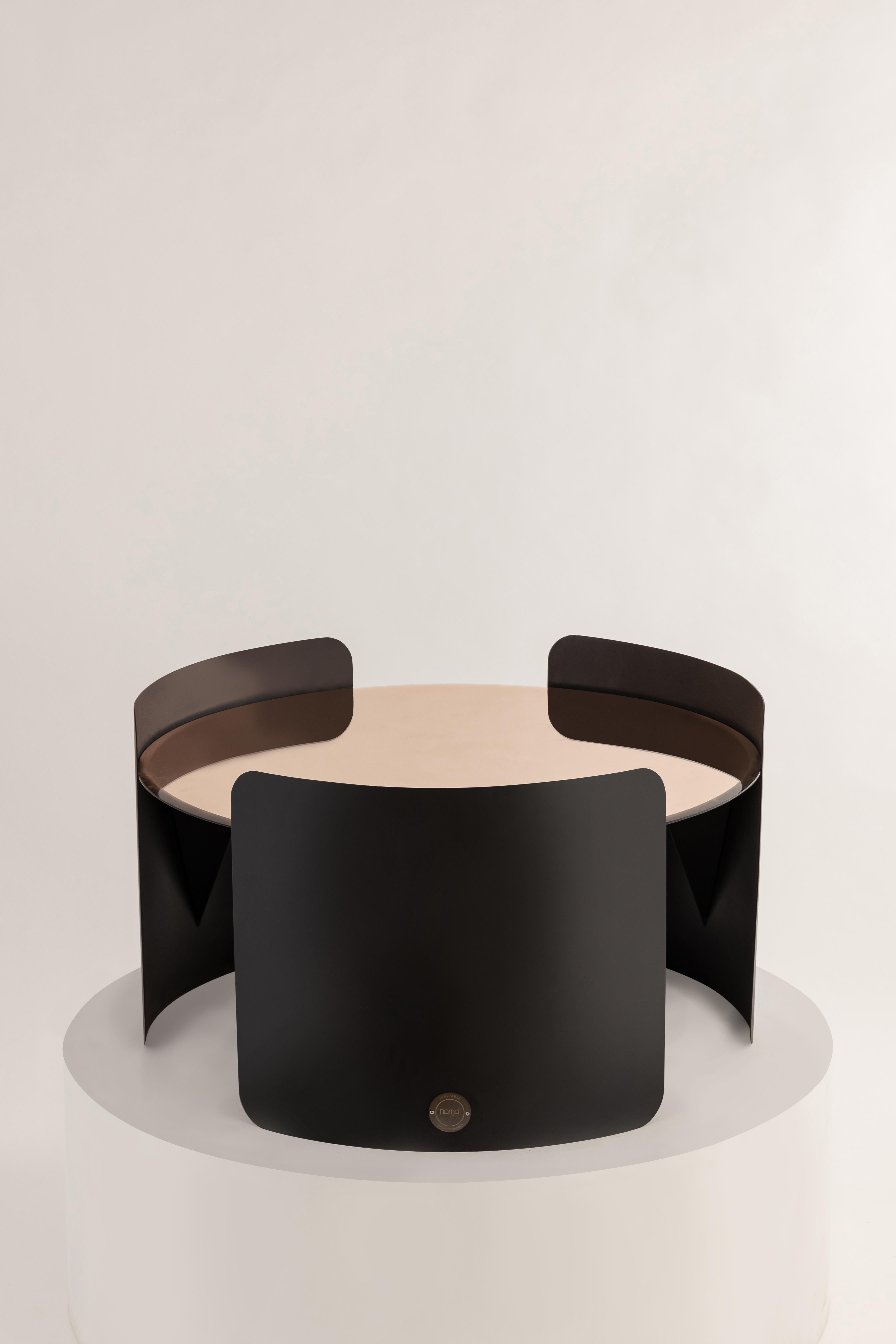 Your day just got cozier with the Hug Coffee Table. Finely crafted without a single harsh edge, this table is an embodiment of affection and elegance.

The circular top is gracefully enveloped by three metal sheets, curving around it like a loving