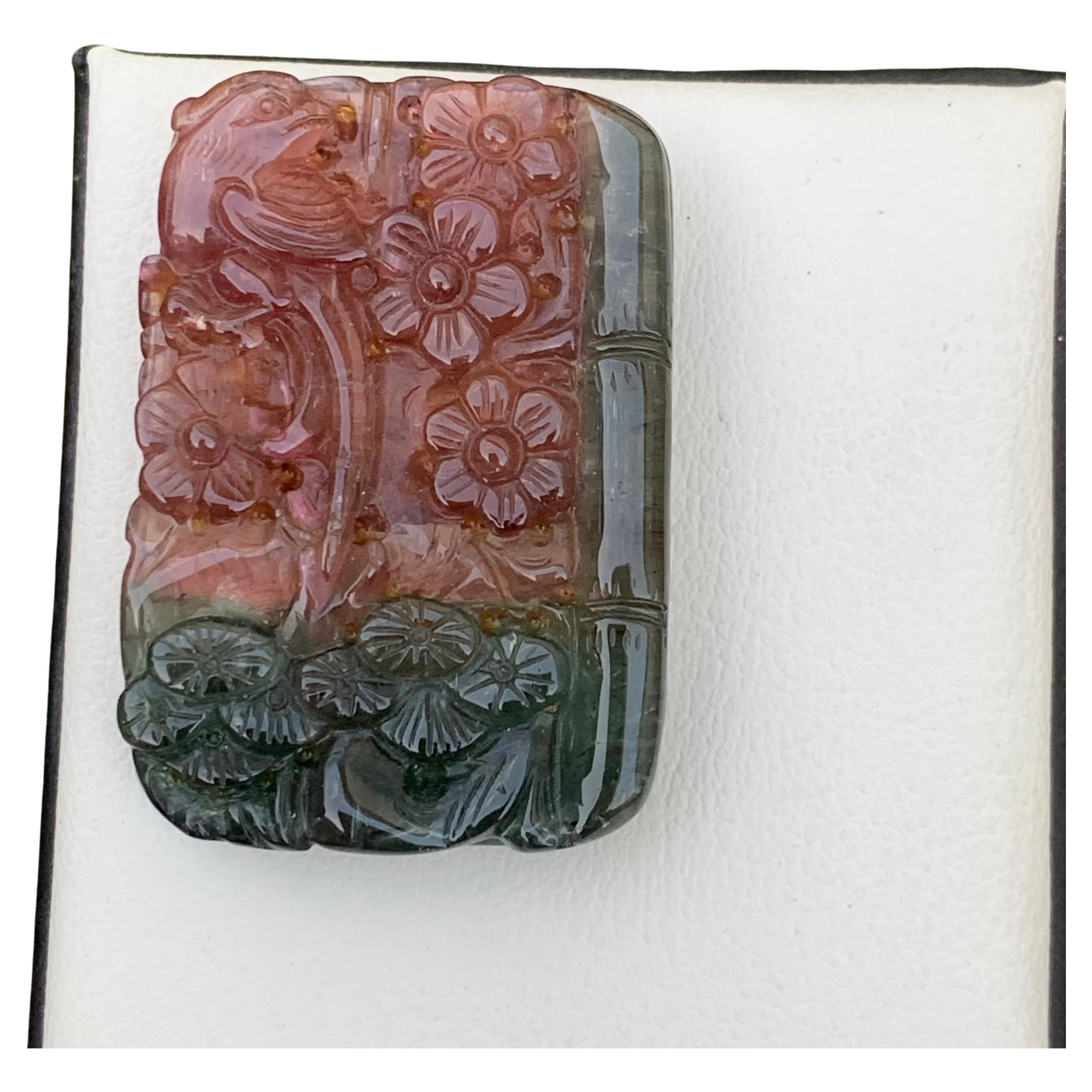 Carving Tourmaline 
Weight: 112 Carats 
Dimension: 40.4x30x7 Mm
Origin: Africa
Shape: Carving
Cut: Flower
Tourmaline carving is a specialized and intricate art form that involves sculpting or shaping tourmaline gemstones to create exquisite and