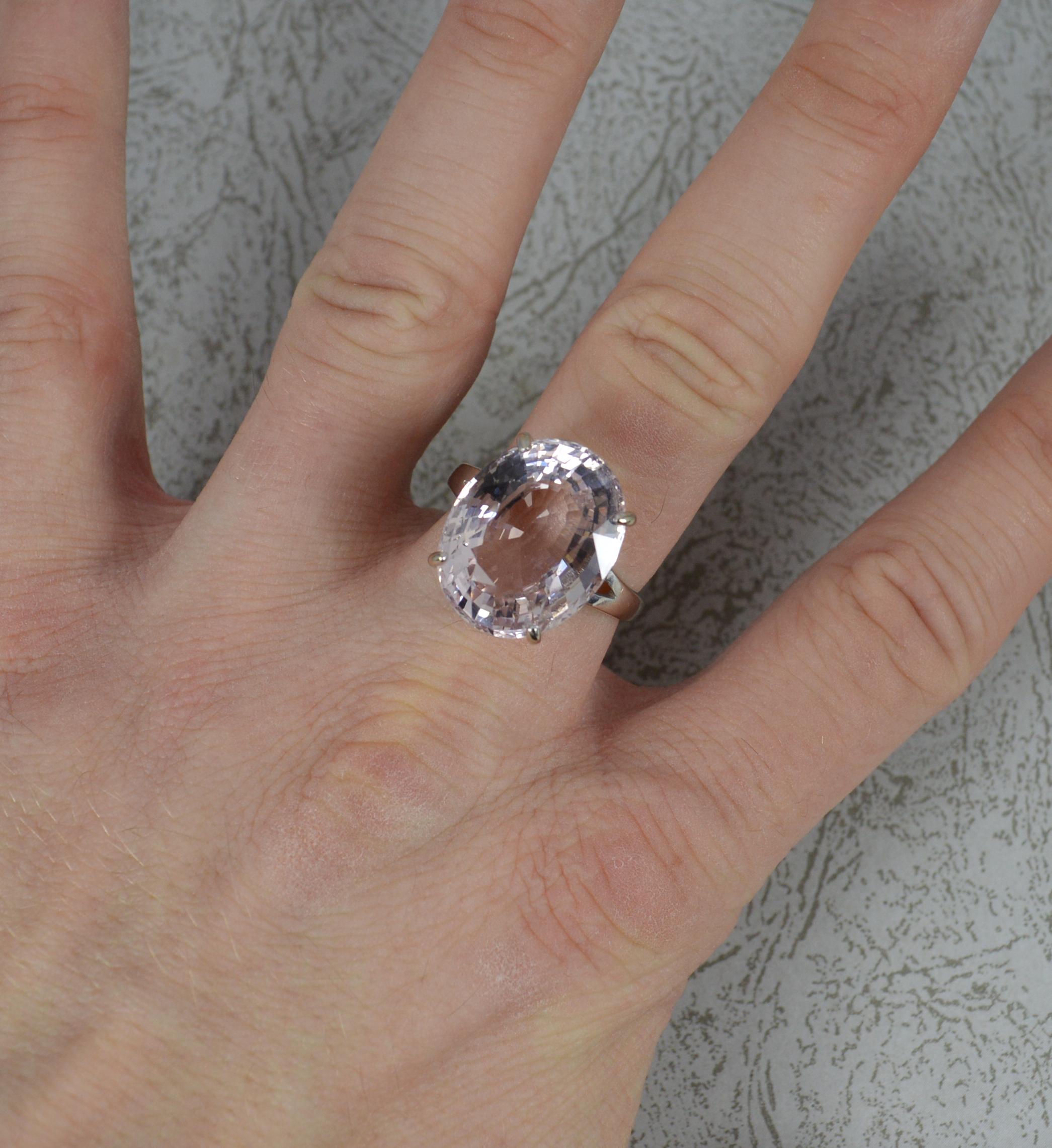A superb statement ring.
Solid 18 carat white gold example.
Designed with an oval cut natural pink kunzite stone in four claw setting. 14mm x 18mm approx 14 carat. Protruding 10mm off the finger.

CONDITION ; Very good. Clean shank. Well set stone,