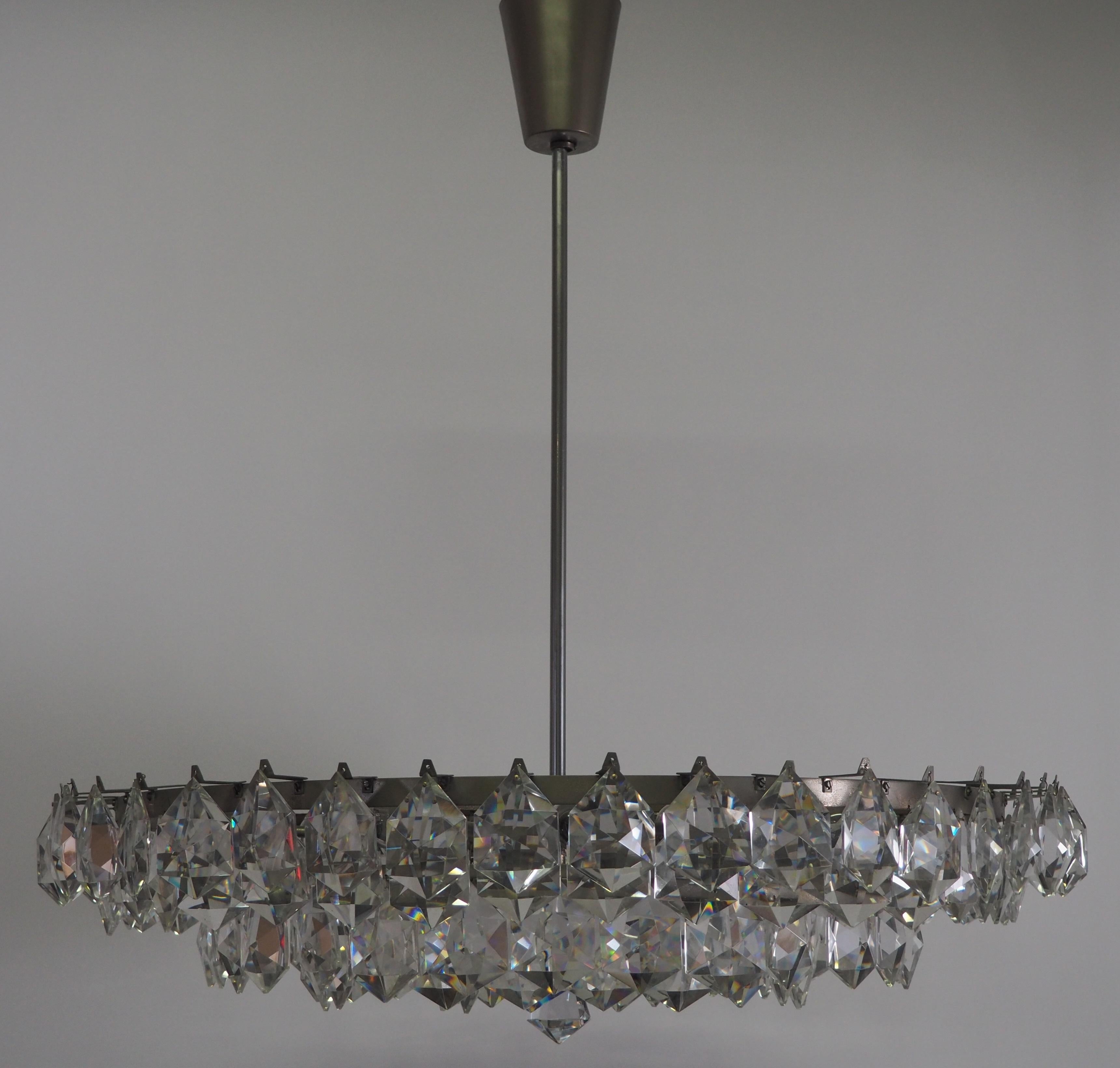Huge mid- century, fifteen - light cut crystal and nickeled brass chandelier by Bakalowits & Soehne, Austria, circa 1960s.

Socket: 15 x e14 for standard screw bulbs.

In a good original condition and with a strong patina.