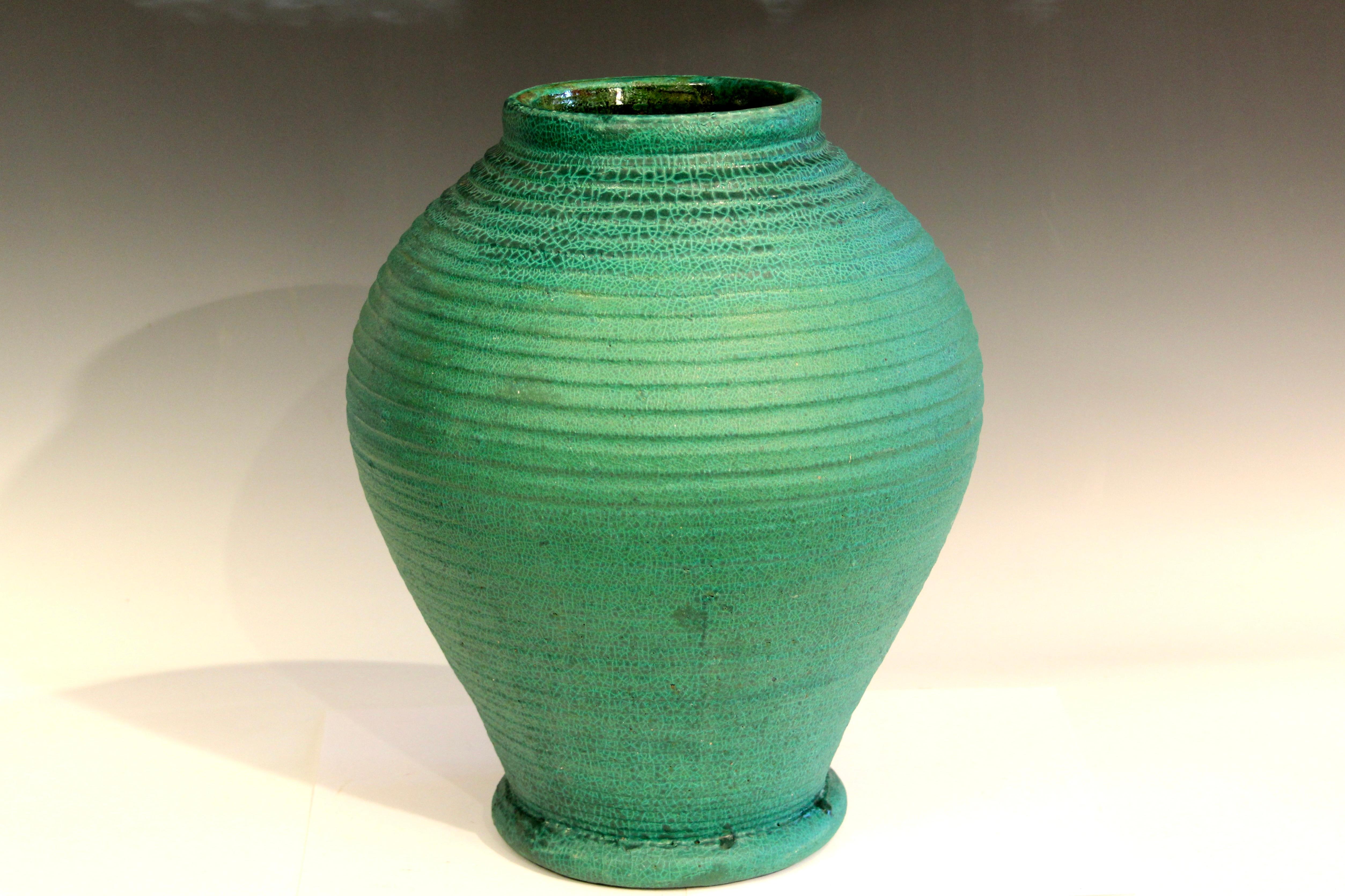 Large antique Merrimac Pottery Arts and Crafts vase in great swelling form with defined ribs and alligatored matt green glaze. Merrimac Pottery operated in Newburyport, Ma. from 1897-1908. Unmarked. 15
