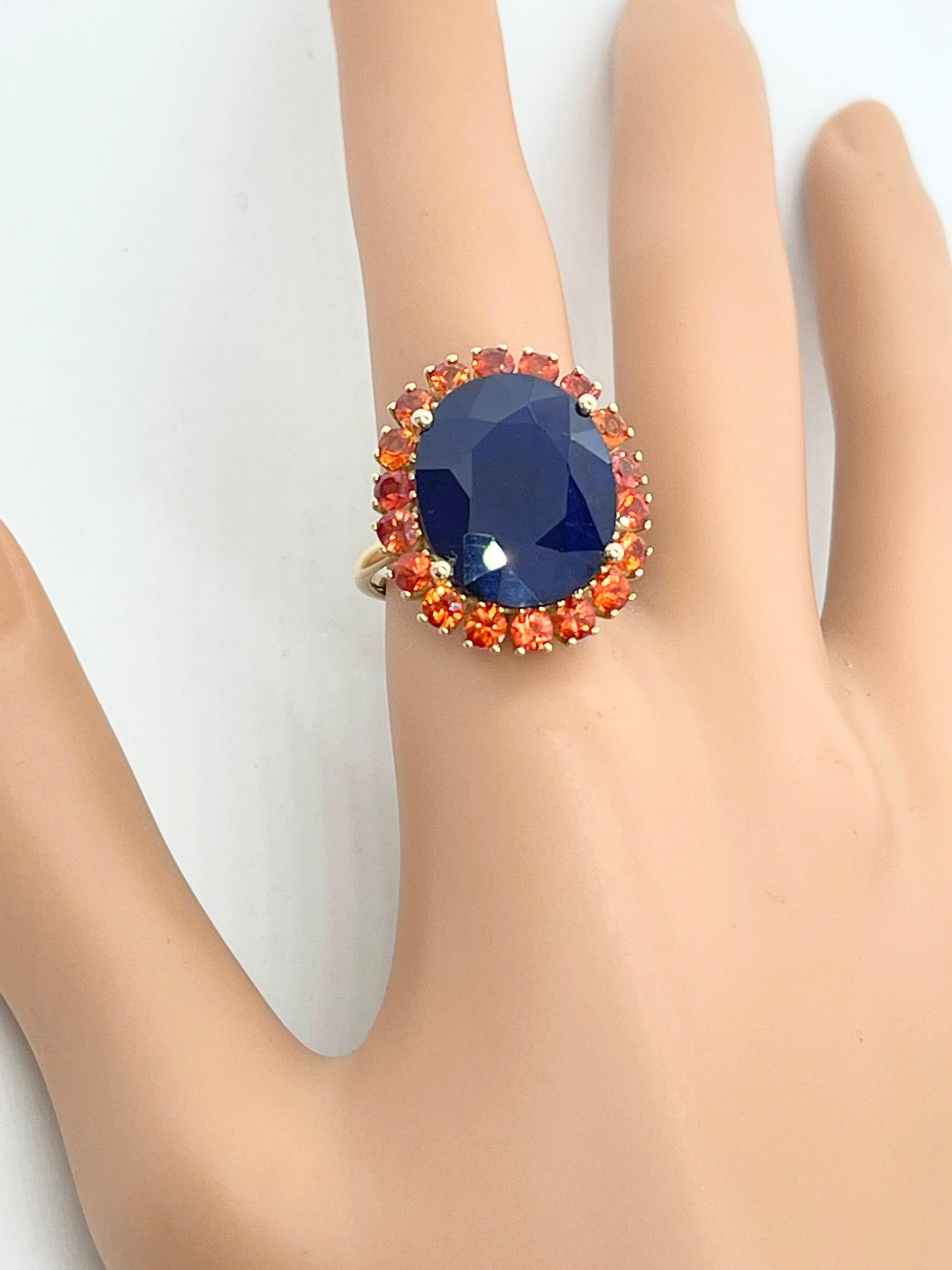 Modern Huge 16ct Natural Blue Sapphire with Orange Sapphire Halo Ring 10ct Yellow Gold For Sale