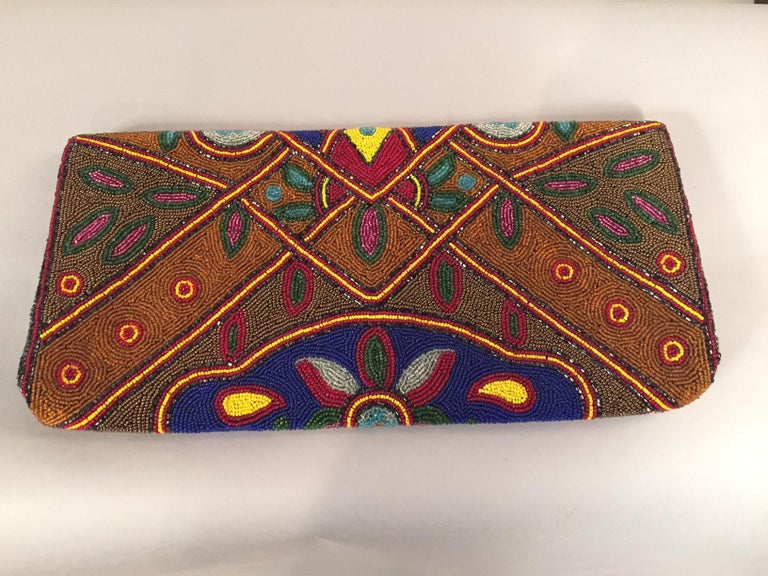 A spectacular multi-color, oversized, 1930's beaded clutch in pristine condition is a very rare find. This bag is 7